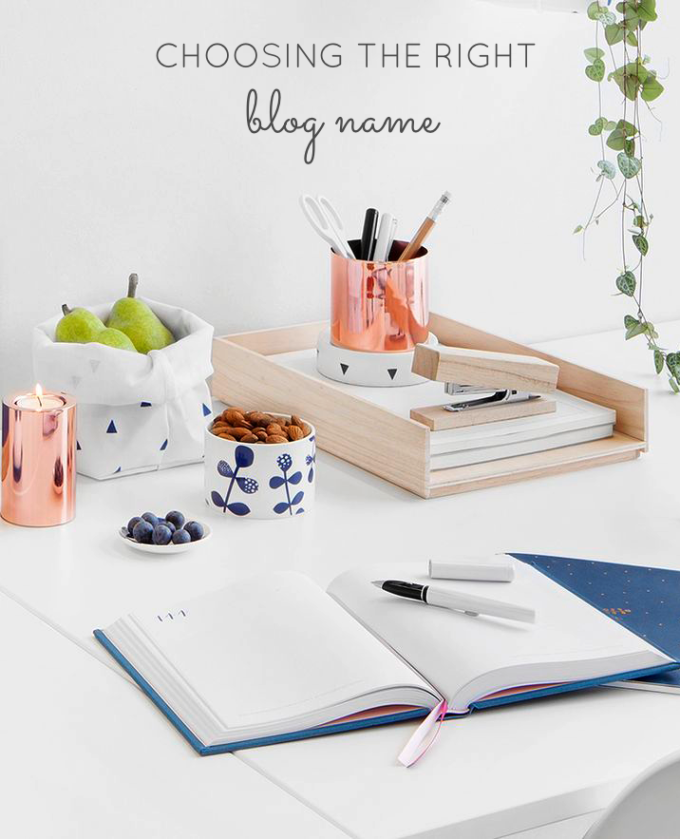 table with notebook and other office supplies for Choosing a Name that Fits