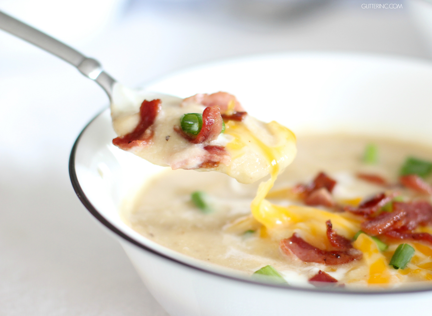 Guys, forget Loaded Baked Potato Soup; Healthy Loaded Cauliflower Soup is where it's at! | Click through for the details. | glitterinc.com | @glitterinc