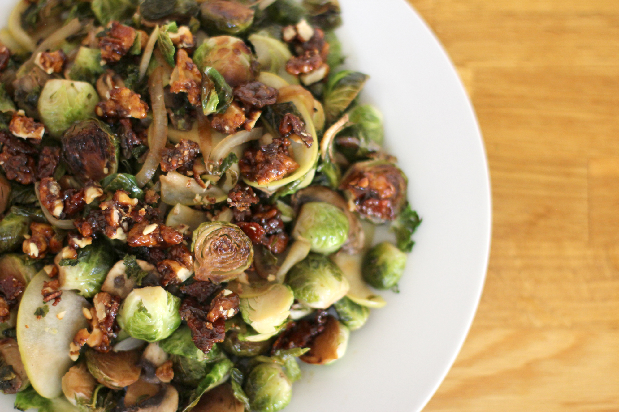 How to Make Brussels Sprouts with Candied Bacon and Walnuts (plus green apples, onions, mushrooms, and kale all tossed in a balsamic glaze!)