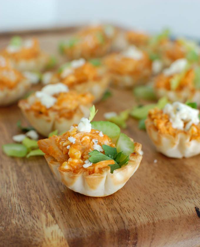 Buffalo Chicken Hummus Bites - 20 Amazing Ways to Eat Hummus (that will become instant favorites in your house!) Snuck into sandwiches, a substitute pizza sauce, a base for salad dressing, in soups, chocolate hummus, and even cooked right into pancakes; after scrolling through these recipes you'll be craving hummus like none other. Click through for the recipes.