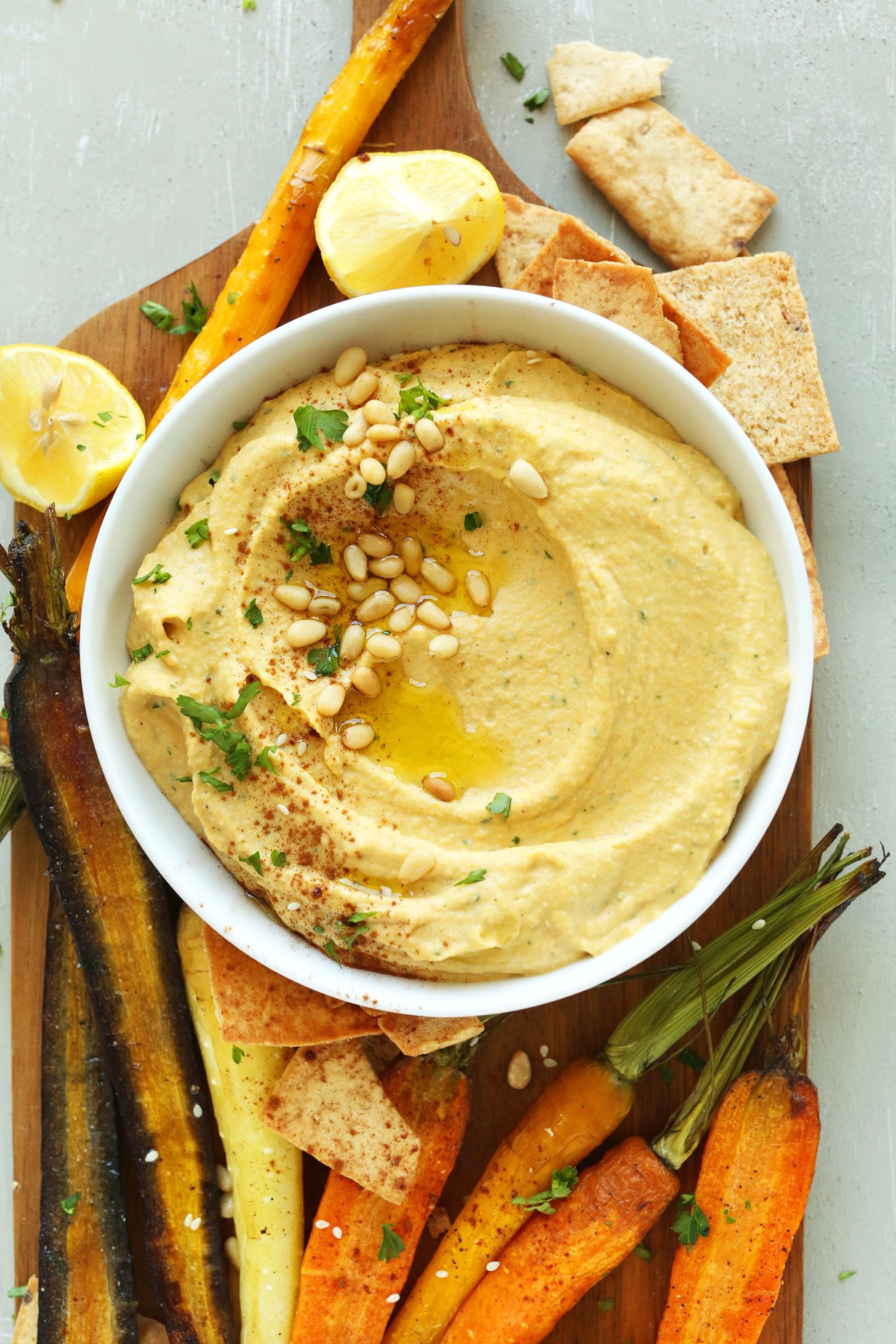 Butternut Squash Hummus with Roasted Vegetables and Pita Chips - 20 Amazing Ways to Eat Hummus (that will become instant favorites in your house!) Snuck into sandwiches, a substitute pizza sauce, a base for salad dressing, in soups, chocolate hummus, and even cooked right into pancakes; after scrolling through these recipes you'll be craving hummus like none other. Click through for the recipes.