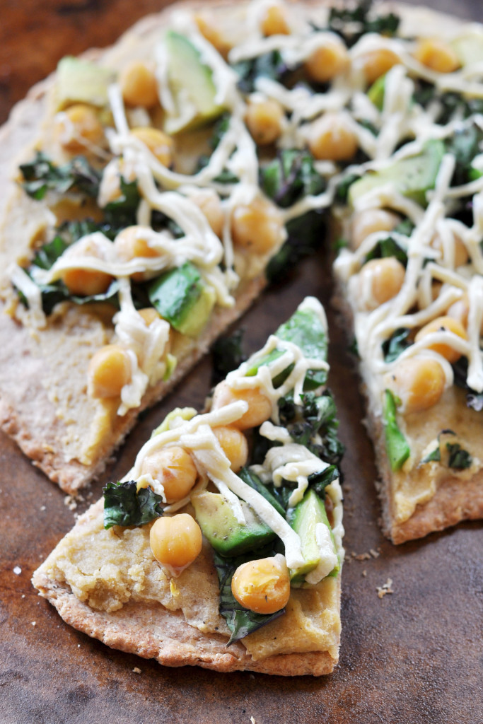 Hummus, Avocado, and Chick Pea Pizza - 20 Amazing Ways to Eat Hummus (that will become instant favorites in your house!) Snuck into sandwiches, a substitute pizza sauce, a base for salad dressing, in soups, chocolate hummus, and even cooked right into pancakes; after scrolling through these recipes you'll be craving hummus like none other. Click through for the recipes.