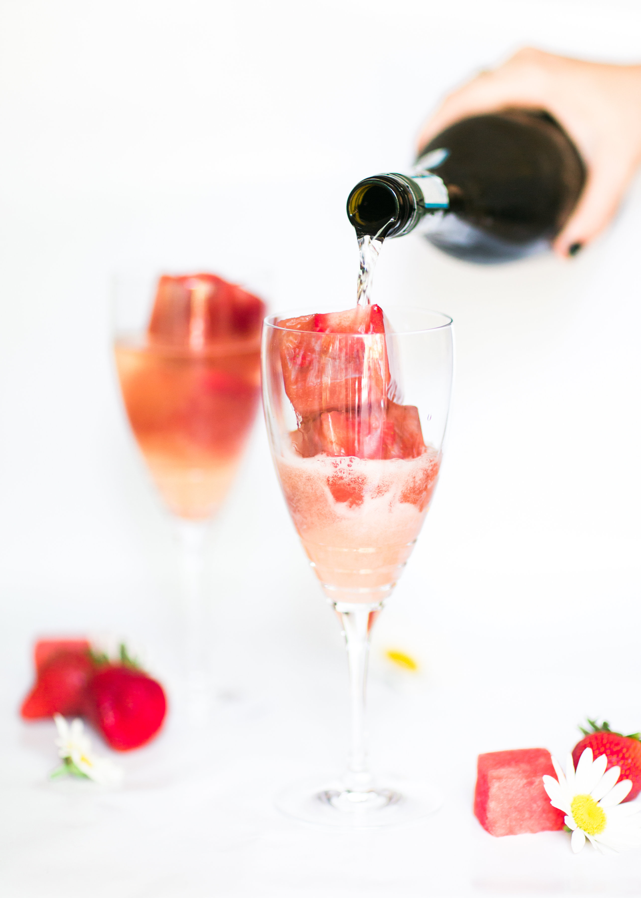 Say hello to your new favorite summer spritzer, made with prosecco and the yummiest giant strawberry watermelon ice cubes.