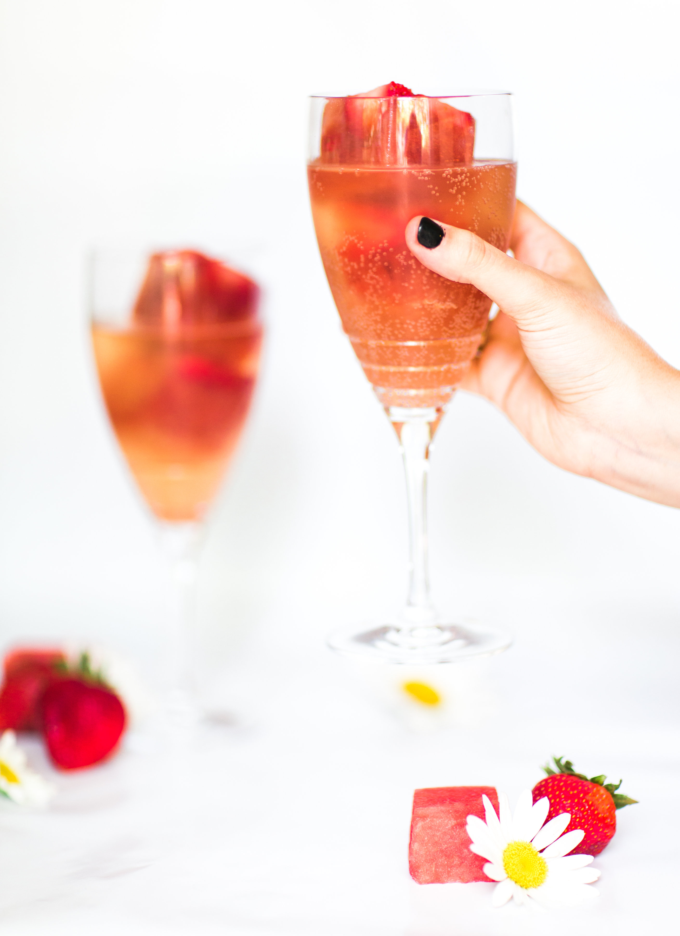 Say hello to your new favorite summer spritzer, made with prosecco and the yummiest giant strawberry watermelon ice cubes.