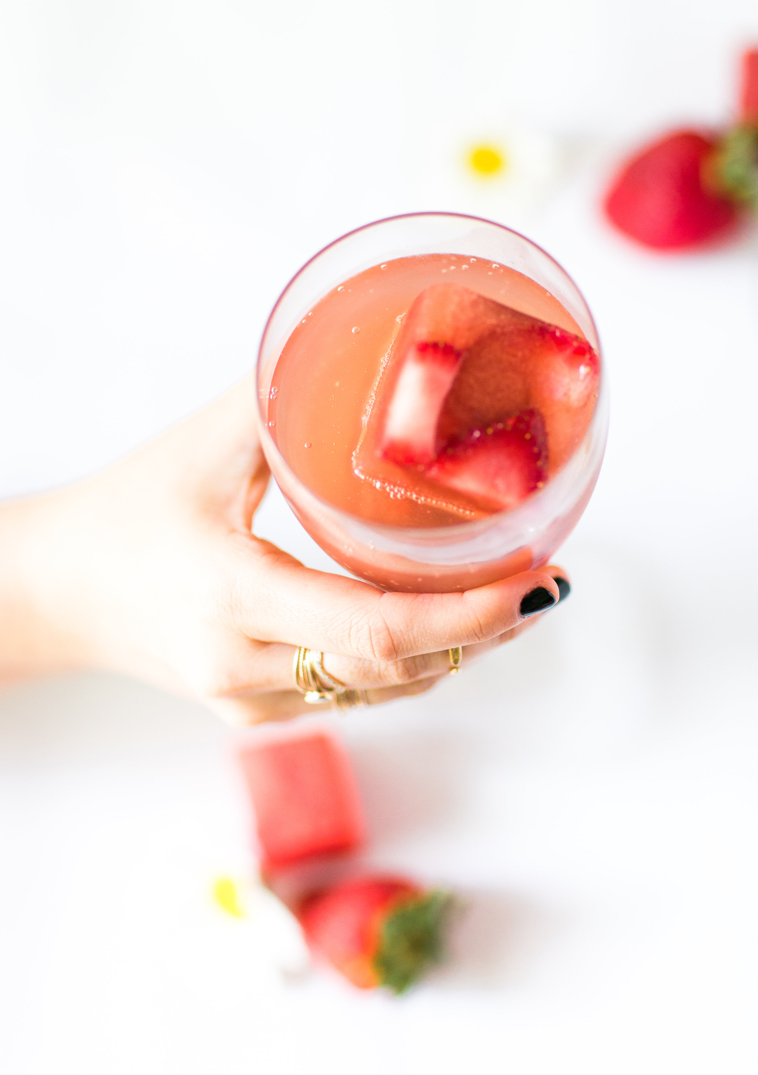 Say hello to your new favorite summer spritzer, made with prosecco and the yummiest giant strawberry watermelon ice cubes.