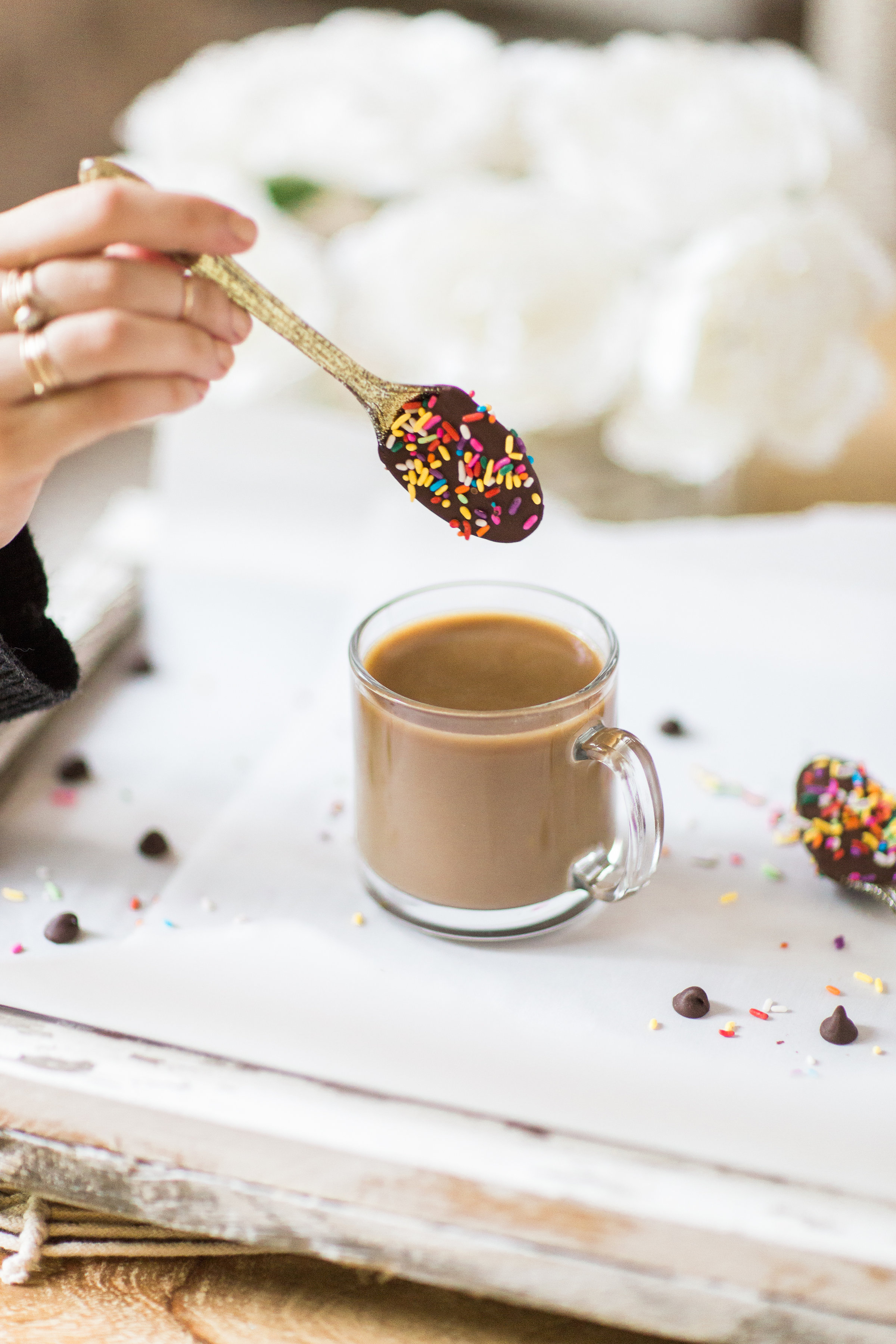 How to make an almond milk chocolate glazed donut coffee with chocolate-dipped sprinkle spoons. Click through for the details. | glitterinc.com | @glitterinc