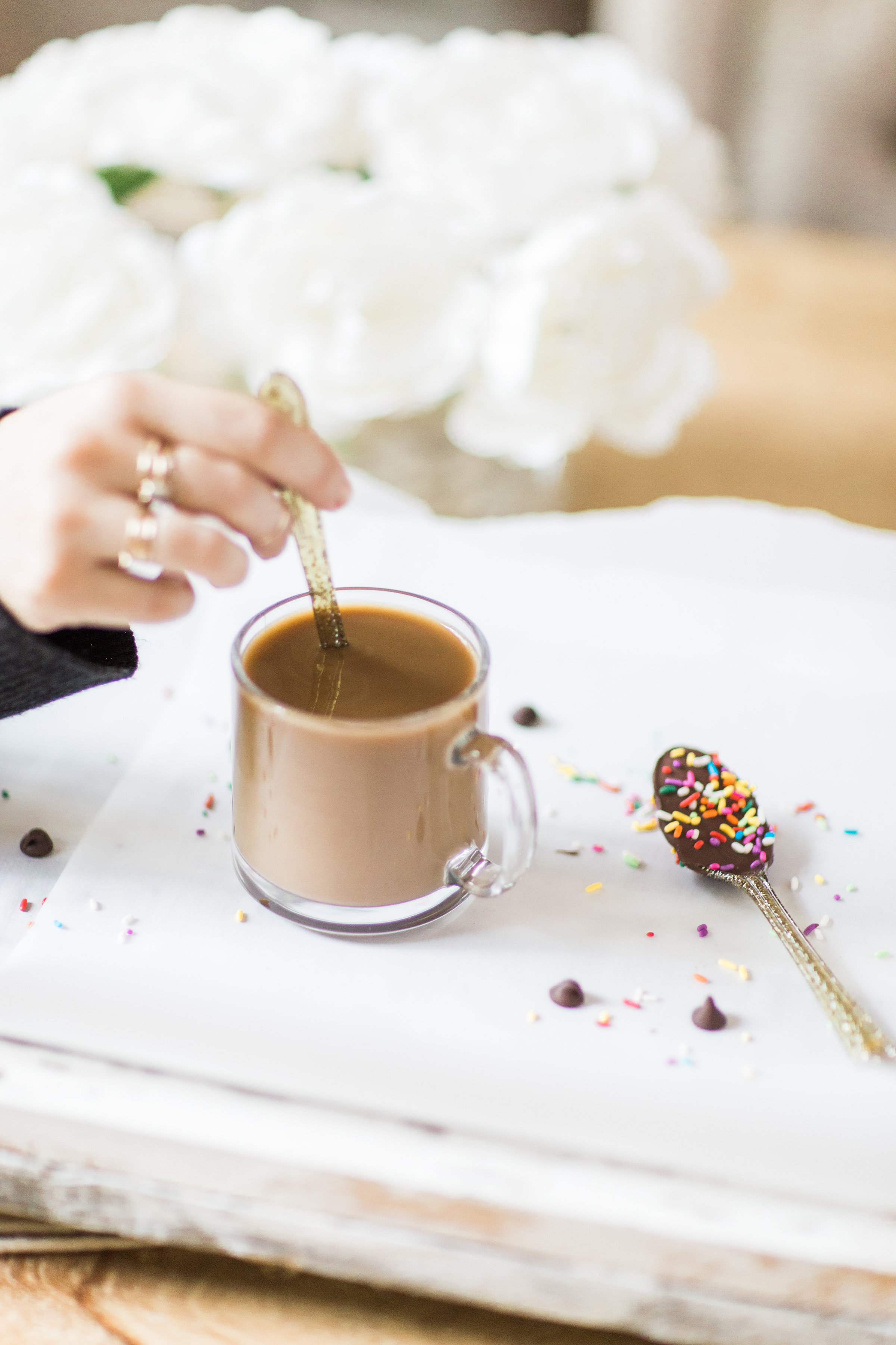 How to make an almond milk chocolate glazed donut coffee with chocolate-dipped sprinkle spoons. Click through for the details. | glitterinc.com | @glitterinc