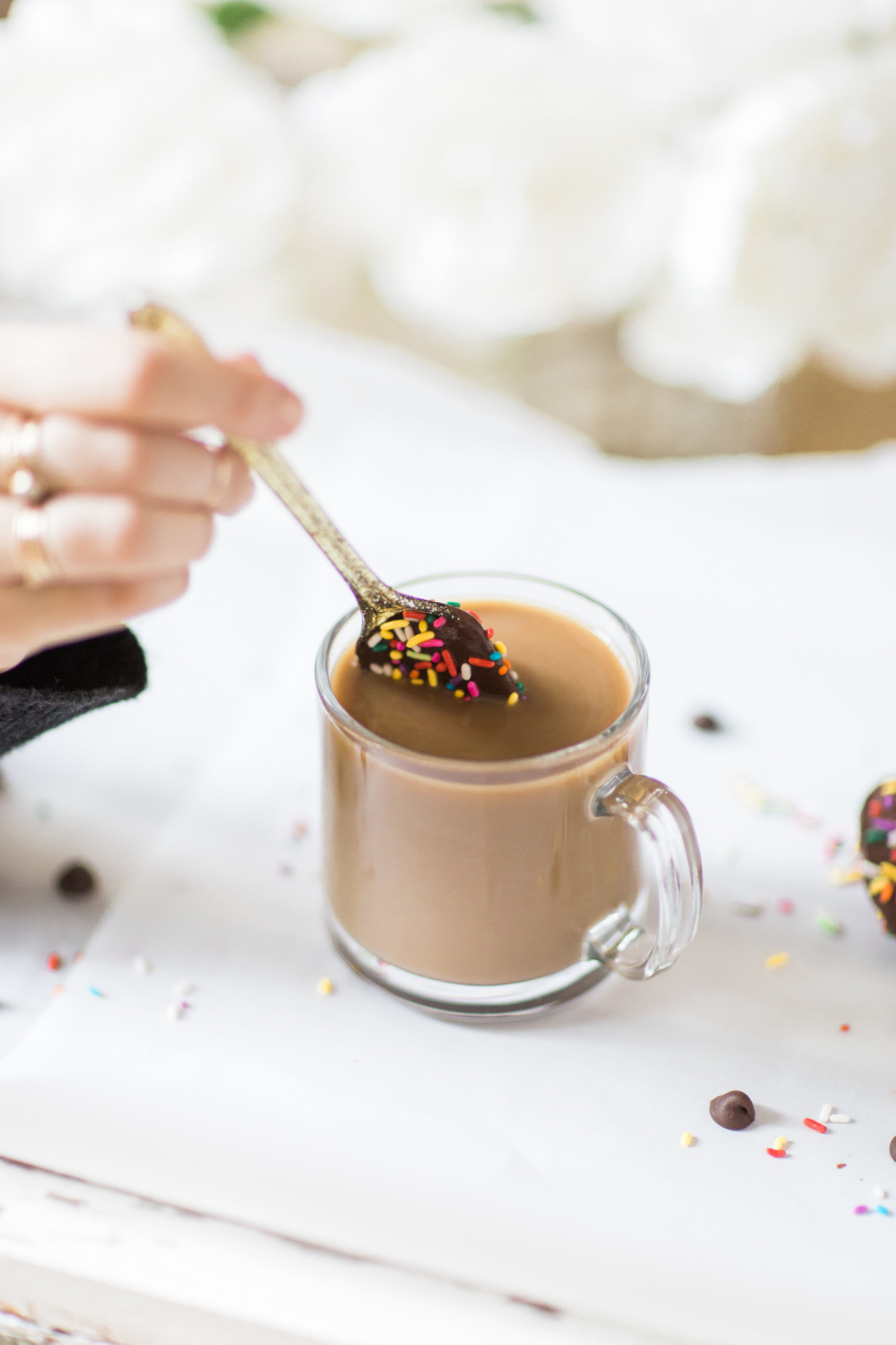 How to make an almond milk chocolate glazed donut coffee with chocolate-dipped sprinkle spoons. Click through for the details. | glitterinc.com | @glitterinc