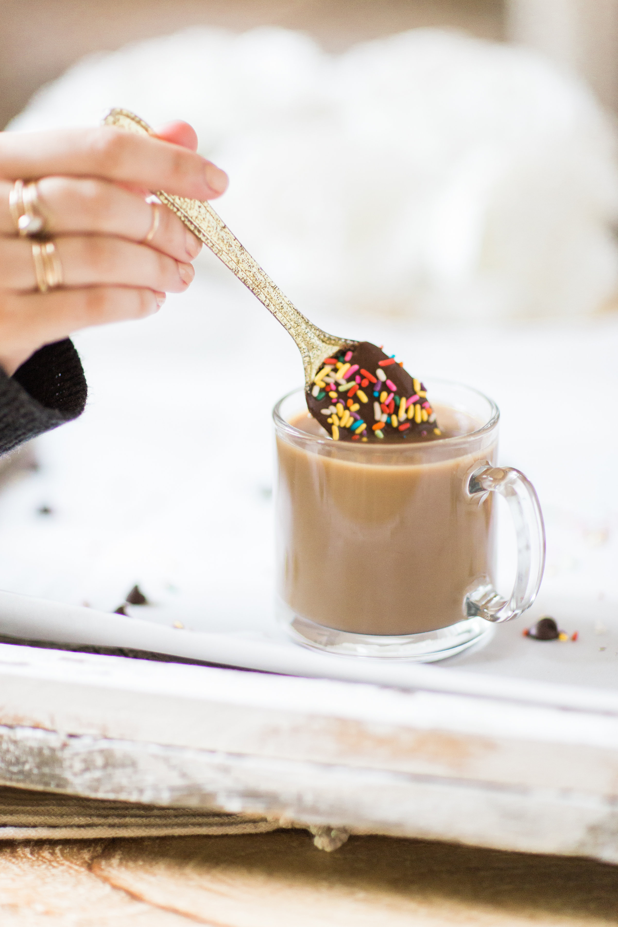 How to make an almond milk chocolate glazed donut coffee with chocolate-dipped sprinkle spoons. Click through for the details. | glitterinc.com | @glitterinc