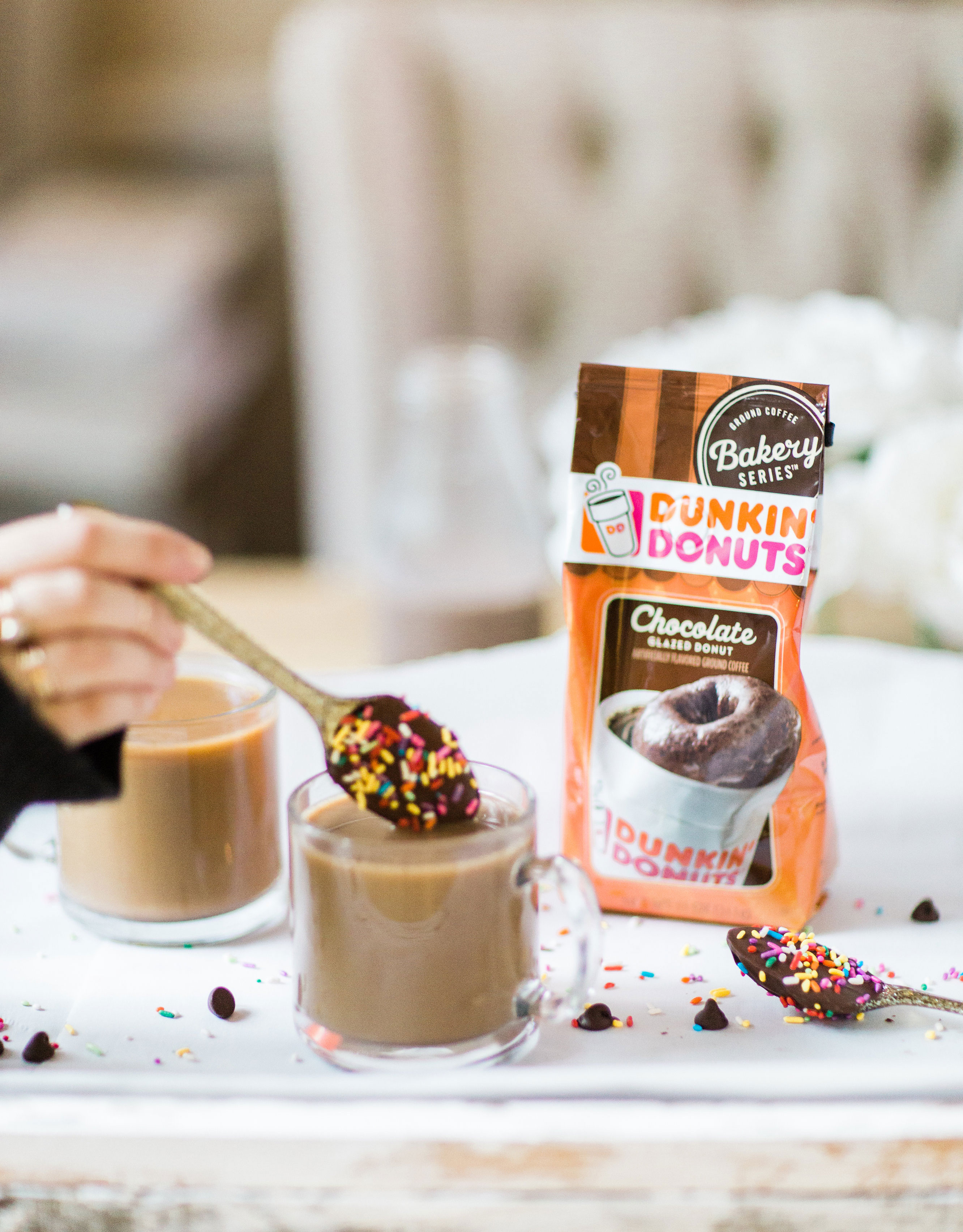 How to make an almond milk chocolate glazed donut coffee with chocolate-dipped sprinkle spoons. Click through for the details. | glitterinc.com | @glitterinc