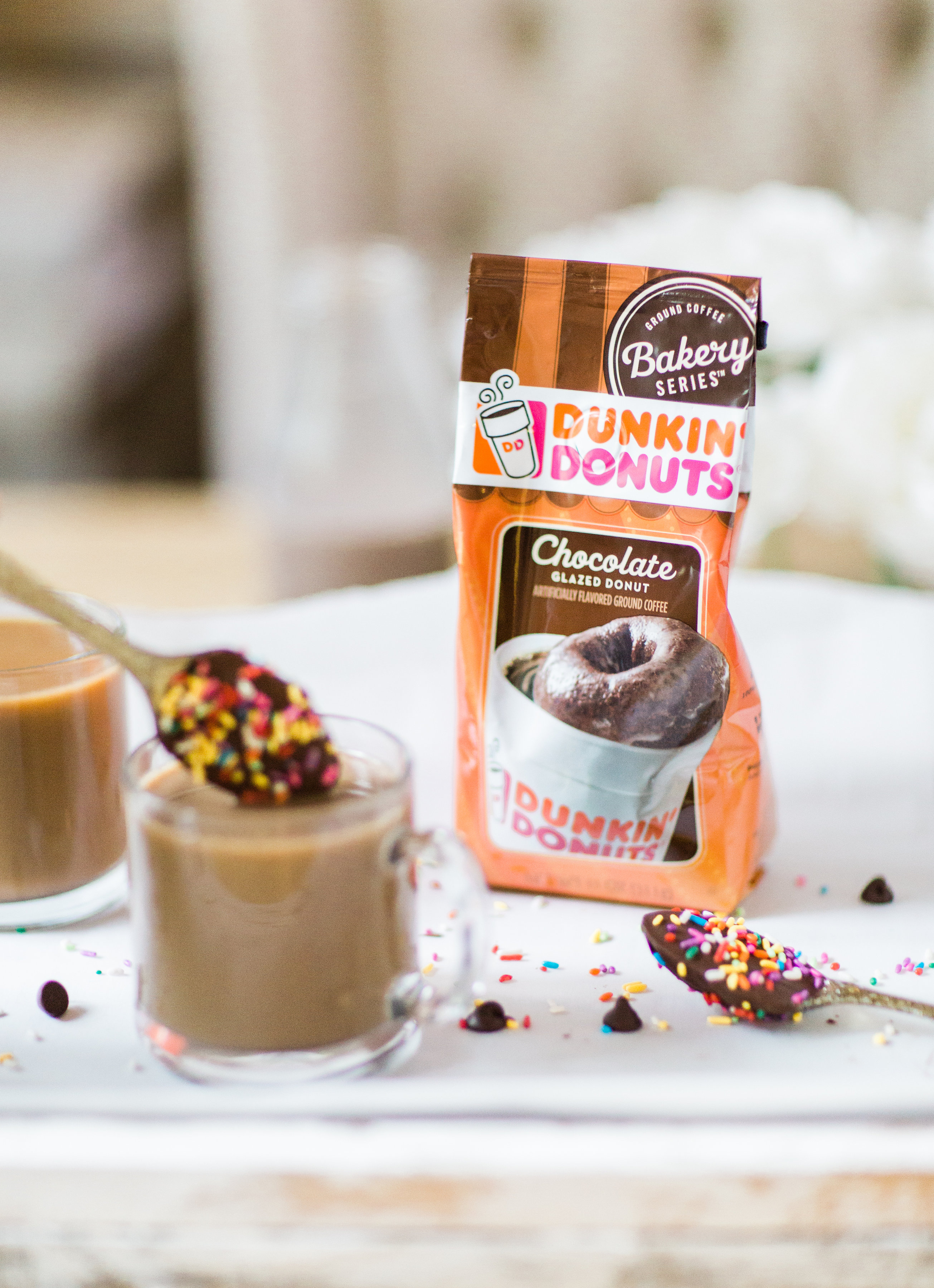 How to make an almond milk chocolate glazed donut coffee with chocolate-dipped sprinkle spoons. Click through for the details. | glitterinc.com | @glitterinc