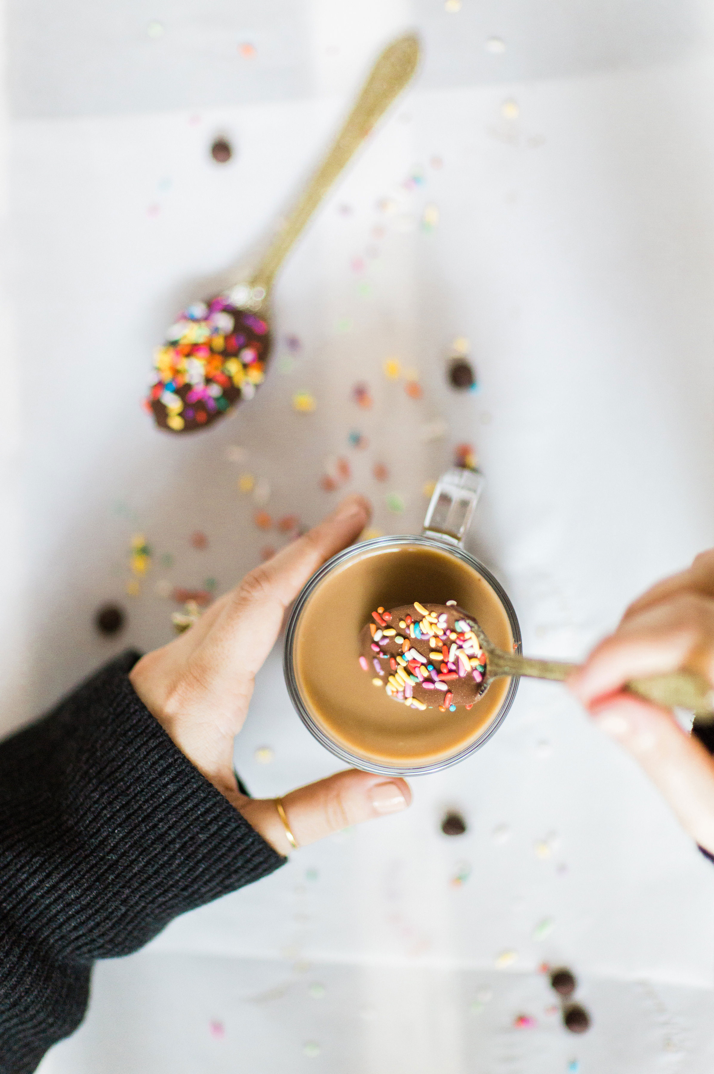 How to make an almond milk chocolate glazed donut coffee with chocolate-dipped sprinkle spoons. Click through for the details. | glitterinc.com | @glitterinc