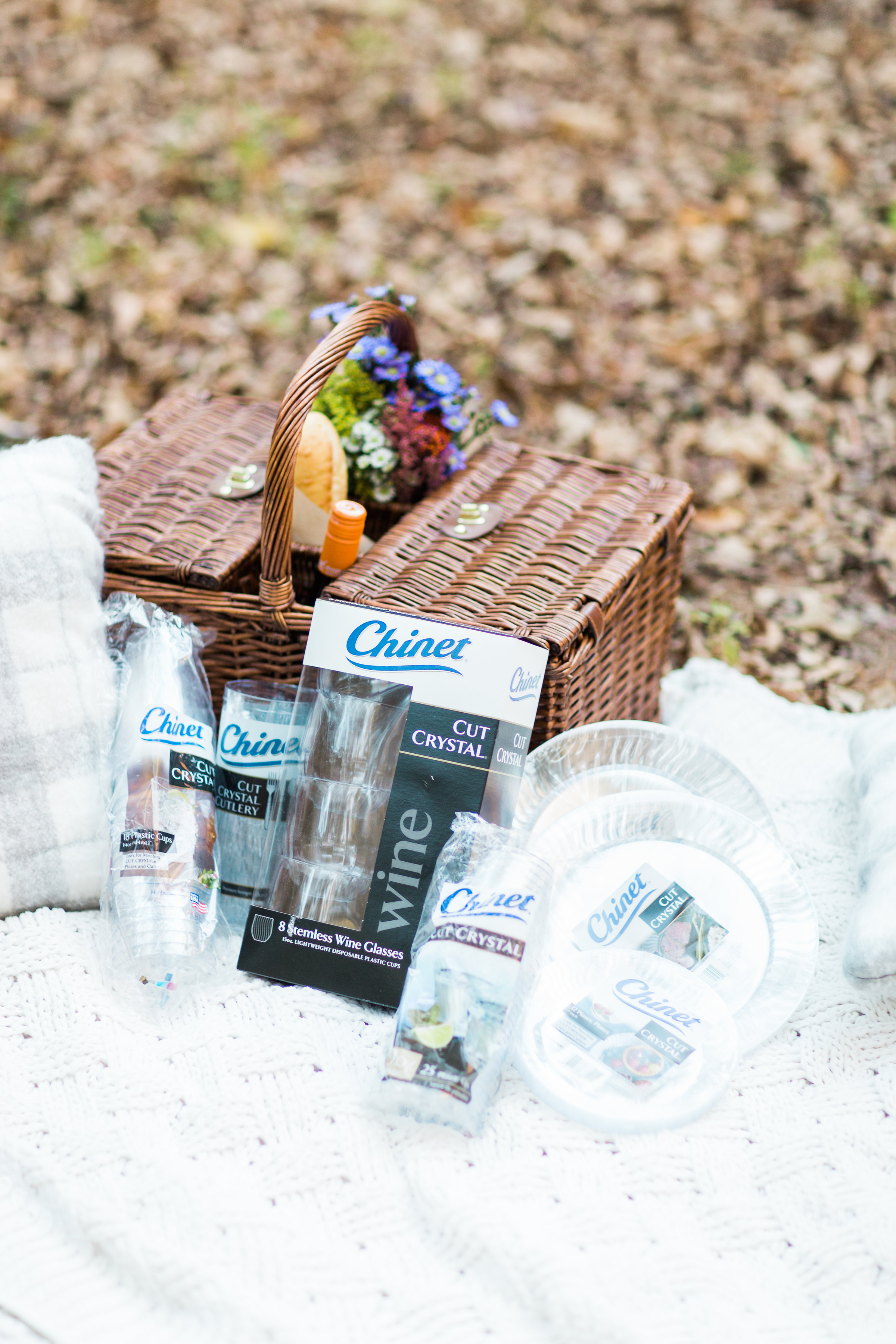 Celebrate in the great outdoors this holiday season with a beautiful and easy-to-put-together holiday picnic, complete with simple charcuterie cheese board, wine, and simple desserts. Click through for the details. | glitterinc.com | @glitterinc