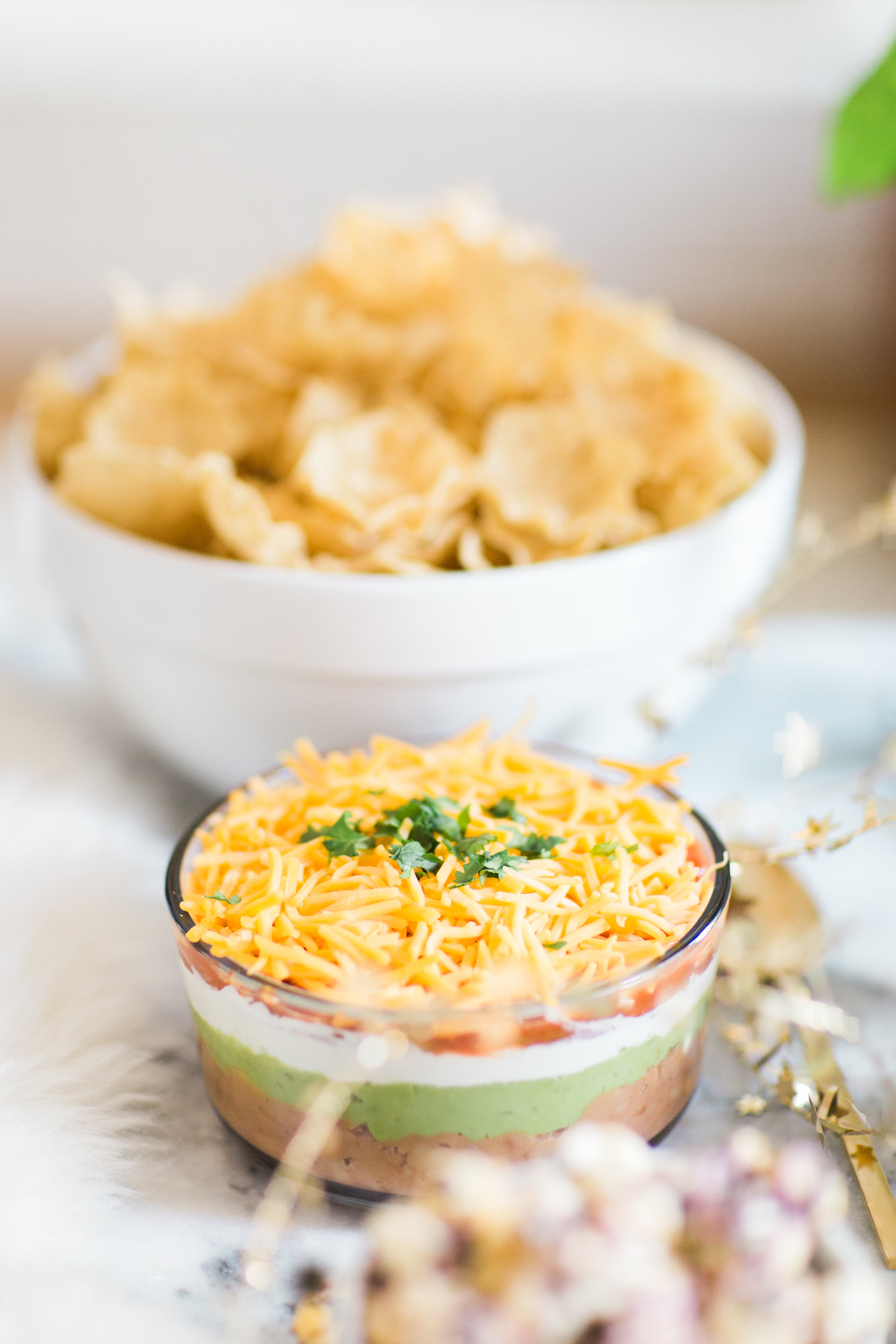 How to make easy 7-layer dip. Click through for the recipe. | glitterinc.com | @glitterinc