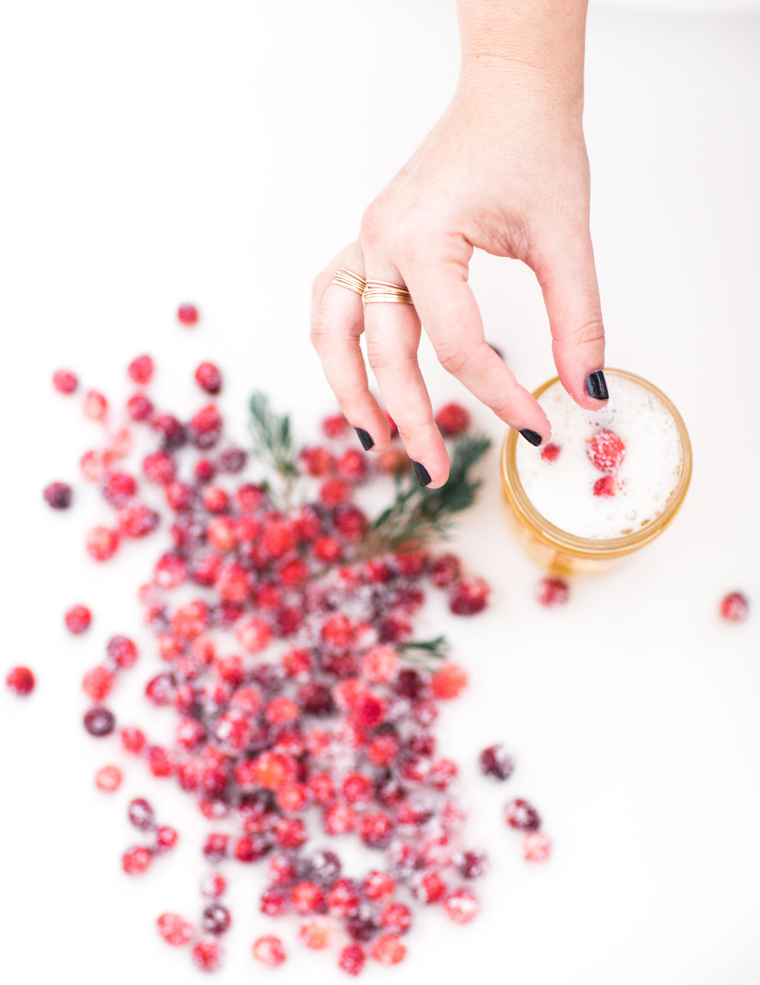 How to make sparkling sugared cranberries for the Holidays that are super simple to make (just two ingredients!) and perfect for dressing up desserts, cheese boards, and cocktails! | glitterinc.com | @glitterinc