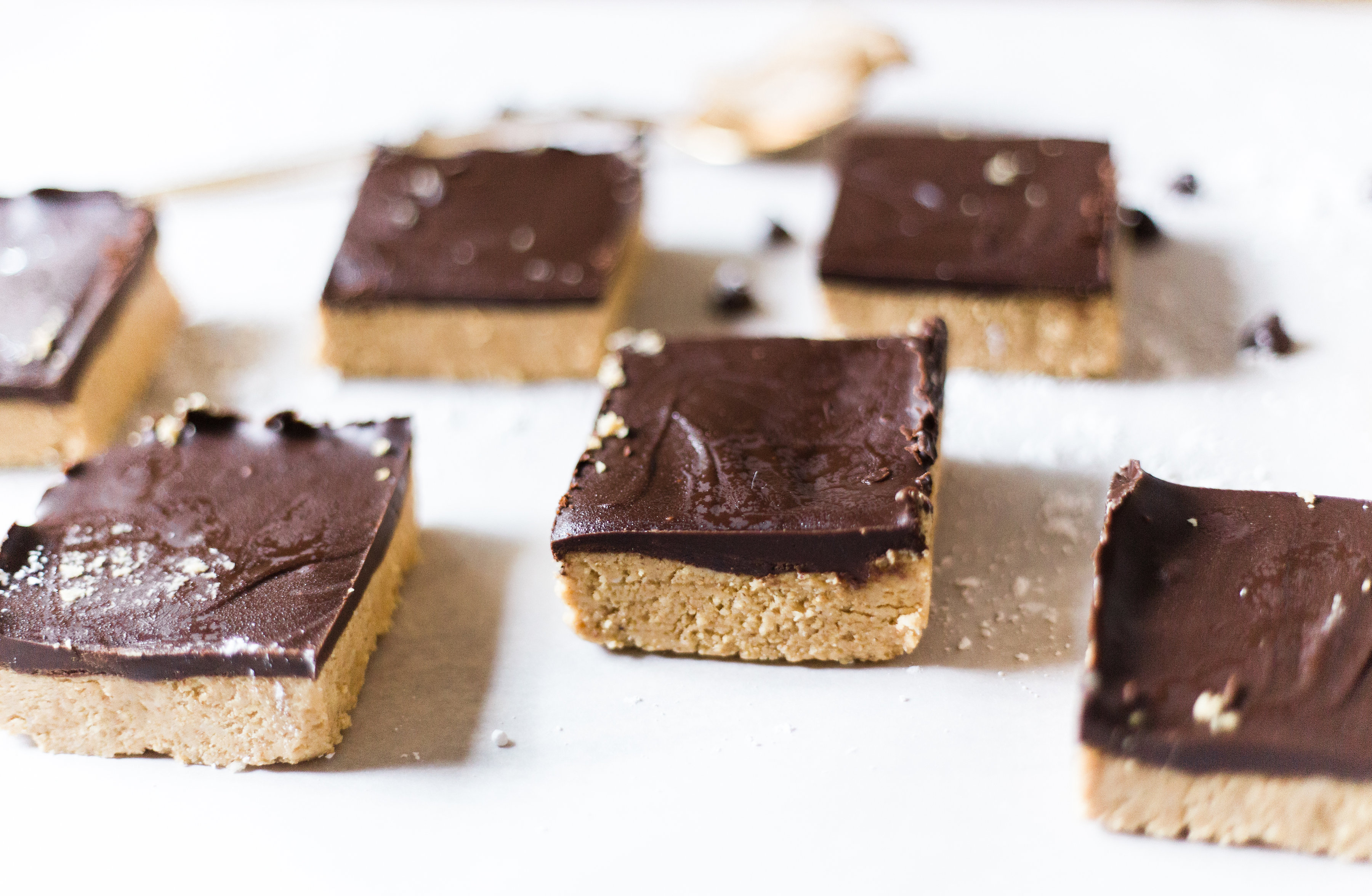 How to make vegan and dairy-free classic peanut butter chocolate squares. You will fall in love with this throwback dessert all over again! Click through for the recipe. | glitterinc.com | @glitterinc