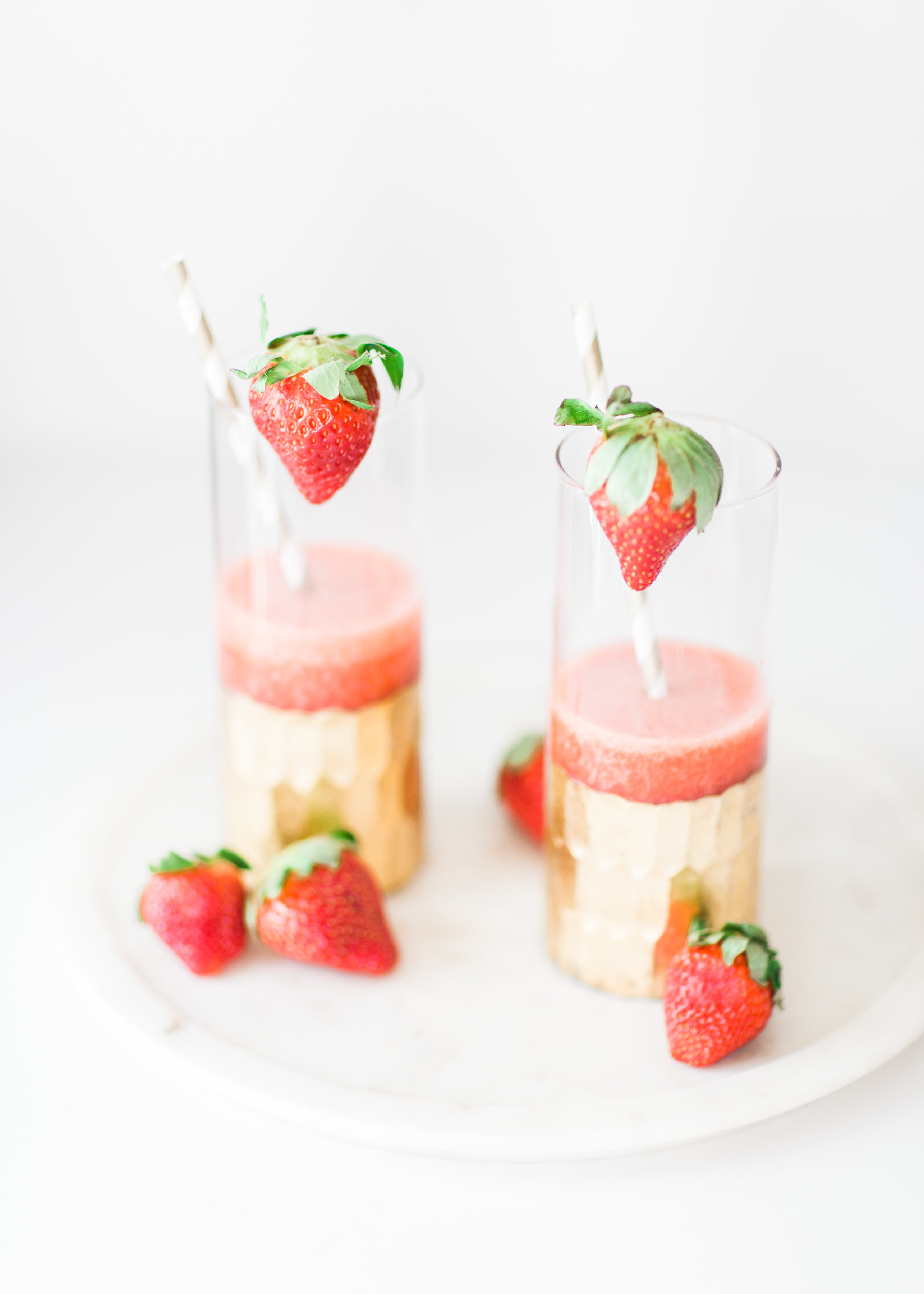 How to Make Boozy Strawberry Slushies. These cocktails are simple, whimsical, fun, and taste freaking delicious. Click through for the recipe. | glitterinc.com | @glitterinc