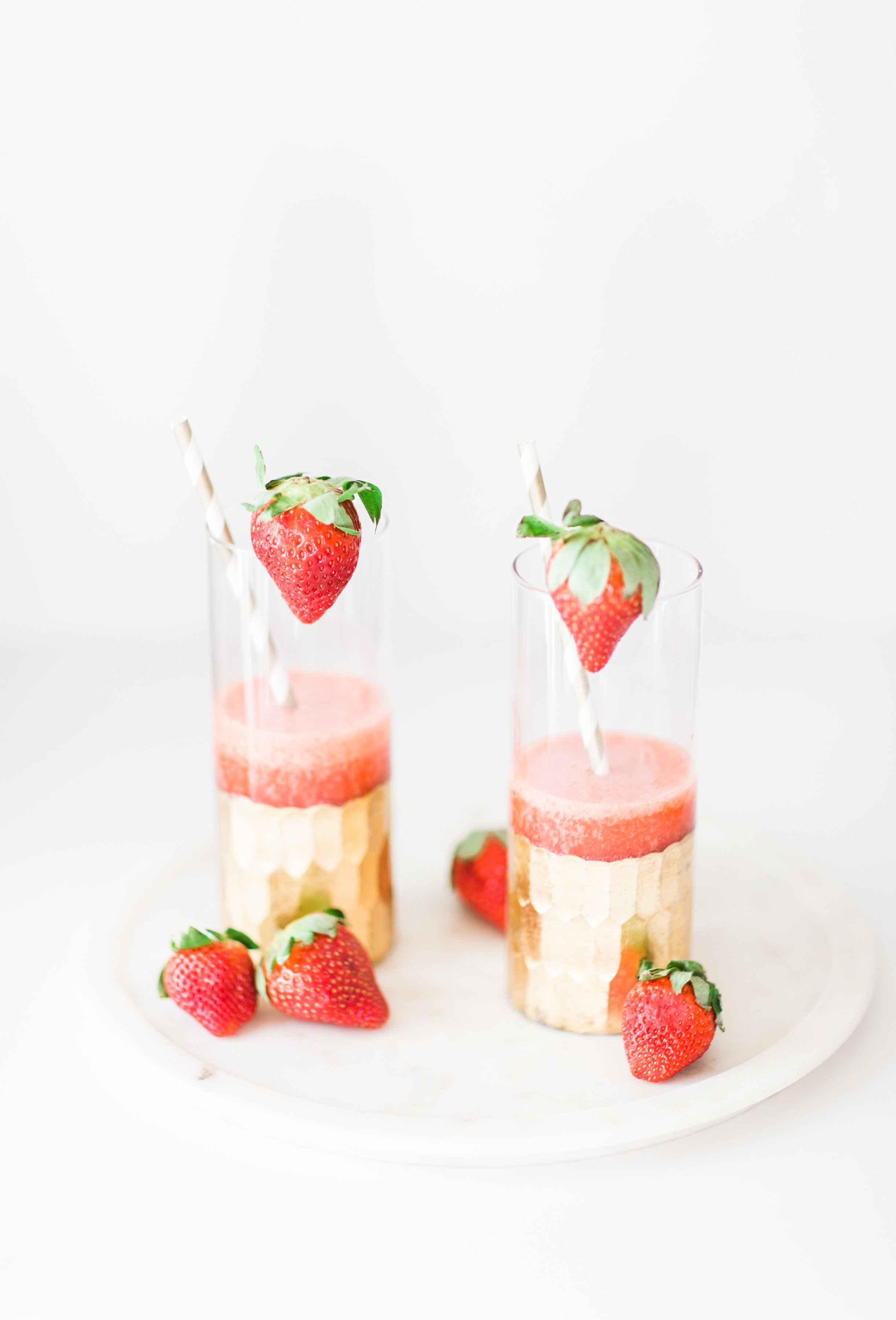 How to Make Boozy Strawberry Slushies. These cocktails are simple, whimsical, fun, and taste freaking delicious. Click through for the recipe. | glitterinc.com | @glitterinc