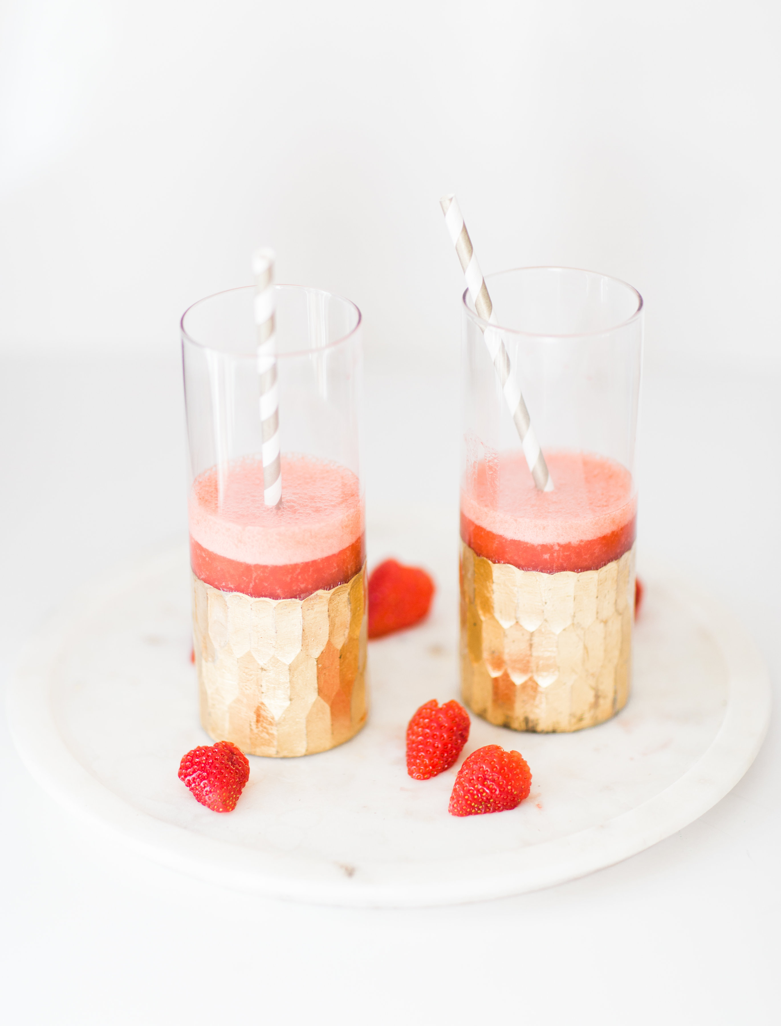 How to Make Boozy Strawberry Slushies. These cocktails are simple, whimsical, fun, and taste freaking delicious. Click through for the recipe. | glitterinc.com | @glitterinc