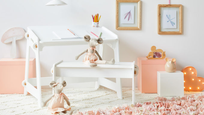 white study table and chair with stuffed toys