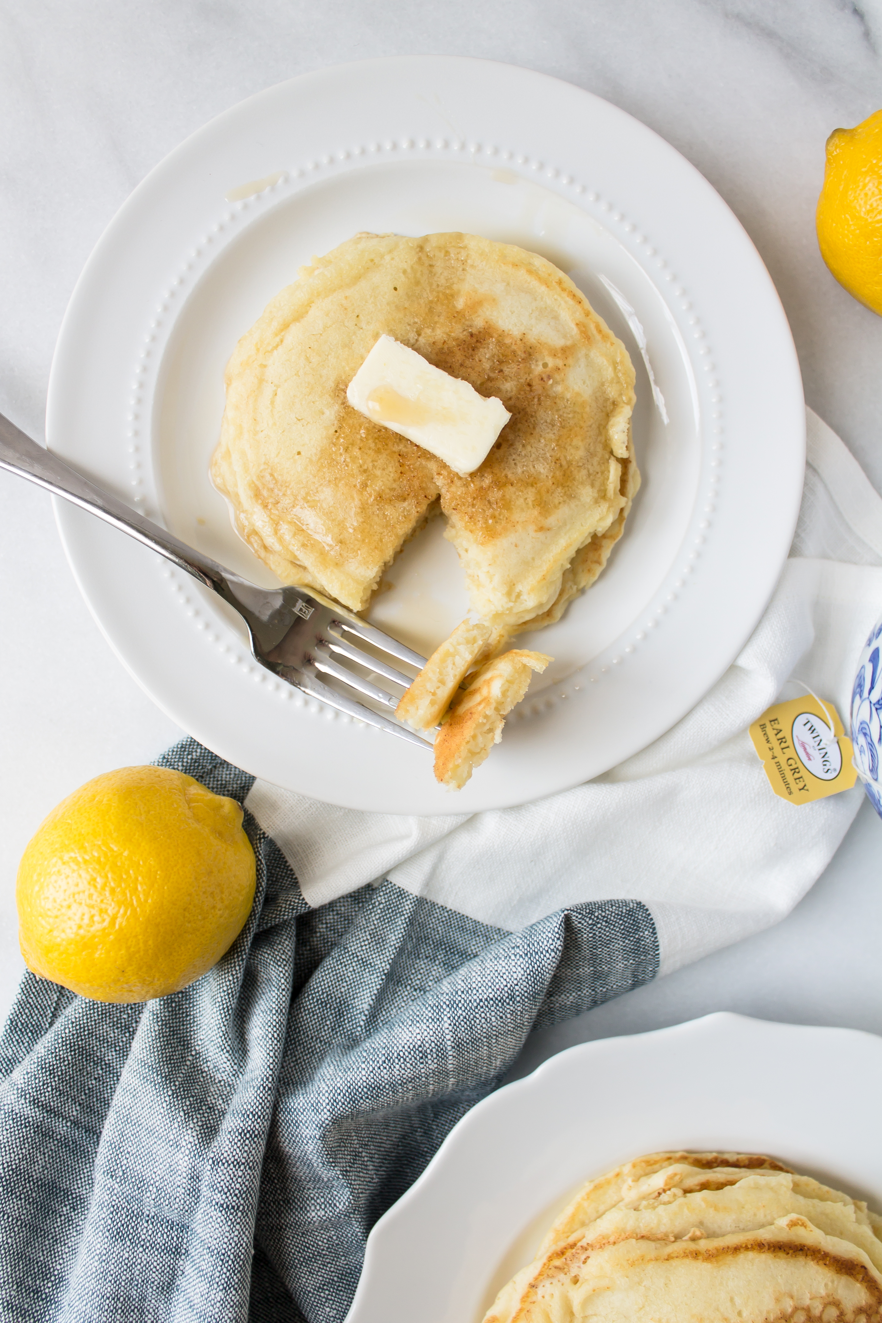 Delicious Lemon Ricotta Pancakes by foodie blogger Lexi of Glitter, Inc. Click through for the recipe. | glitterinc.com | @glitterinc