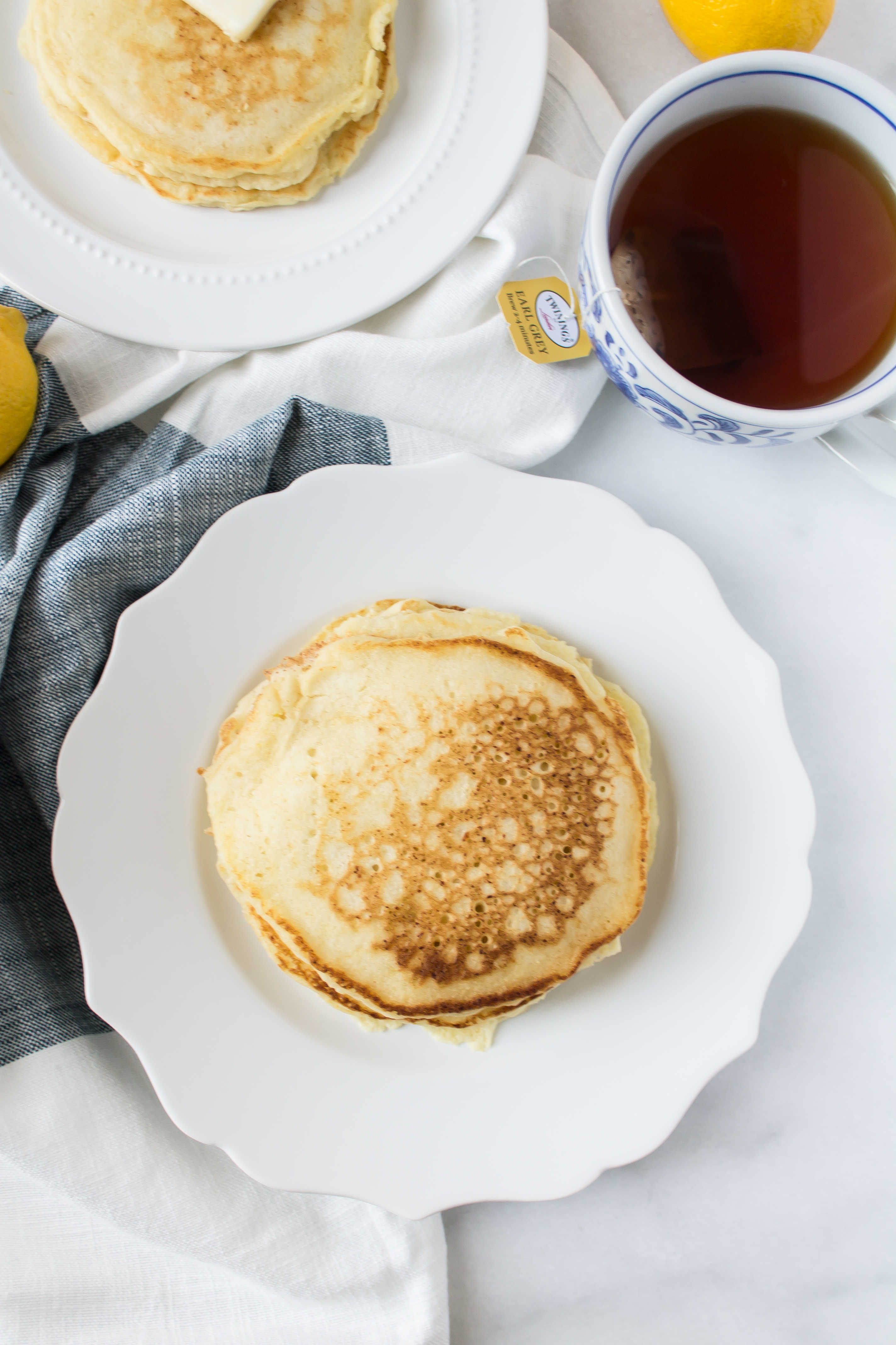 Delicious Lemon Ricotta Pancakes by foodie blogger Lexi of Glitter, Inc. Click through for the recipe. | glitterinc.com | @glitterinc