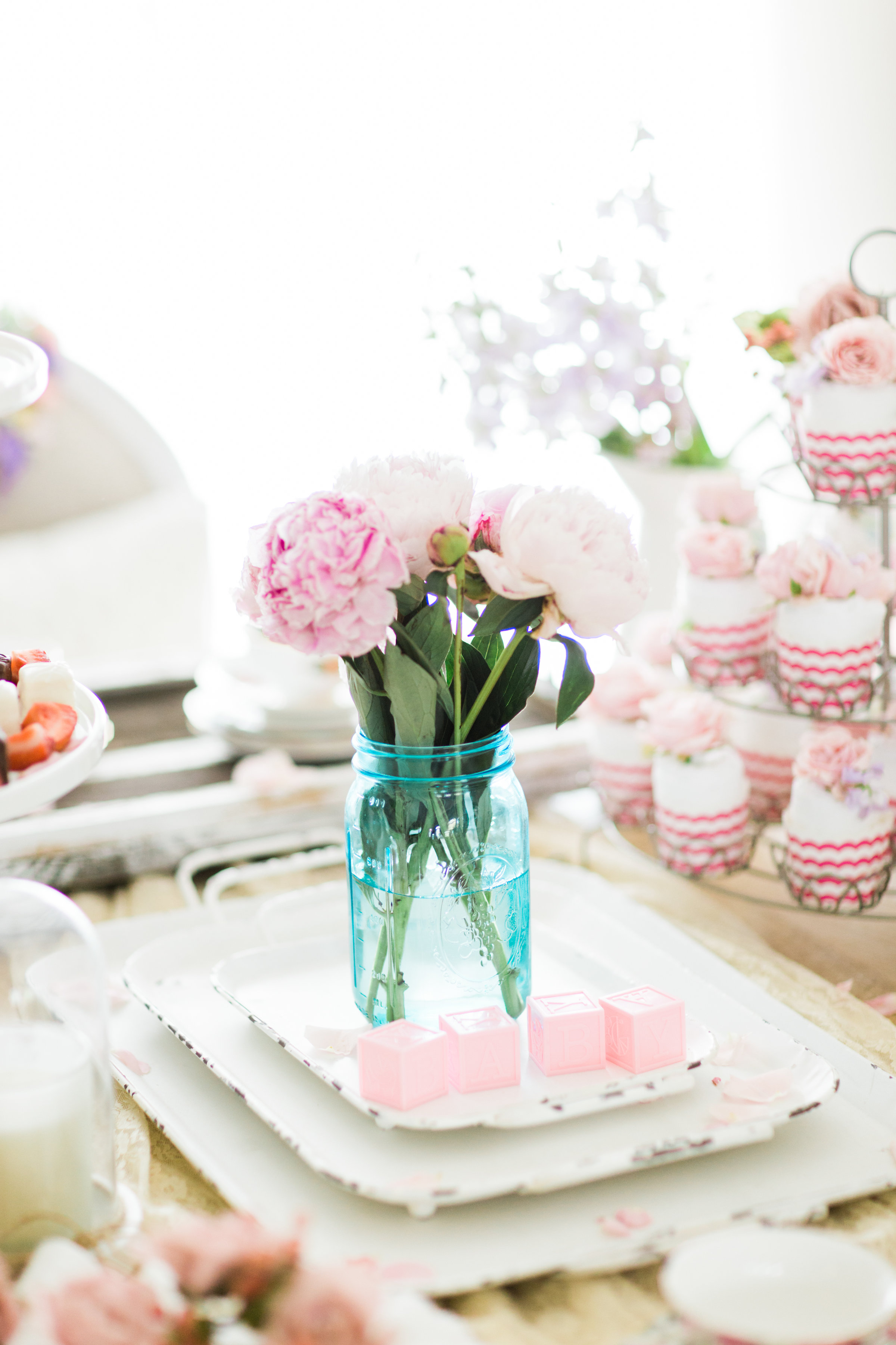 Lifestyle blogger Lexi of Glitter, Inc. shares how to throw a tea party baby shower in 6 easy steps; plus a DIY diaper cake using cupcake liners! #babyshower #teaparty #teapartybabyshower #shower #teapartyshower #party #newbaby #baby | Click through for the details. | glitterinc.com | @glitterinc