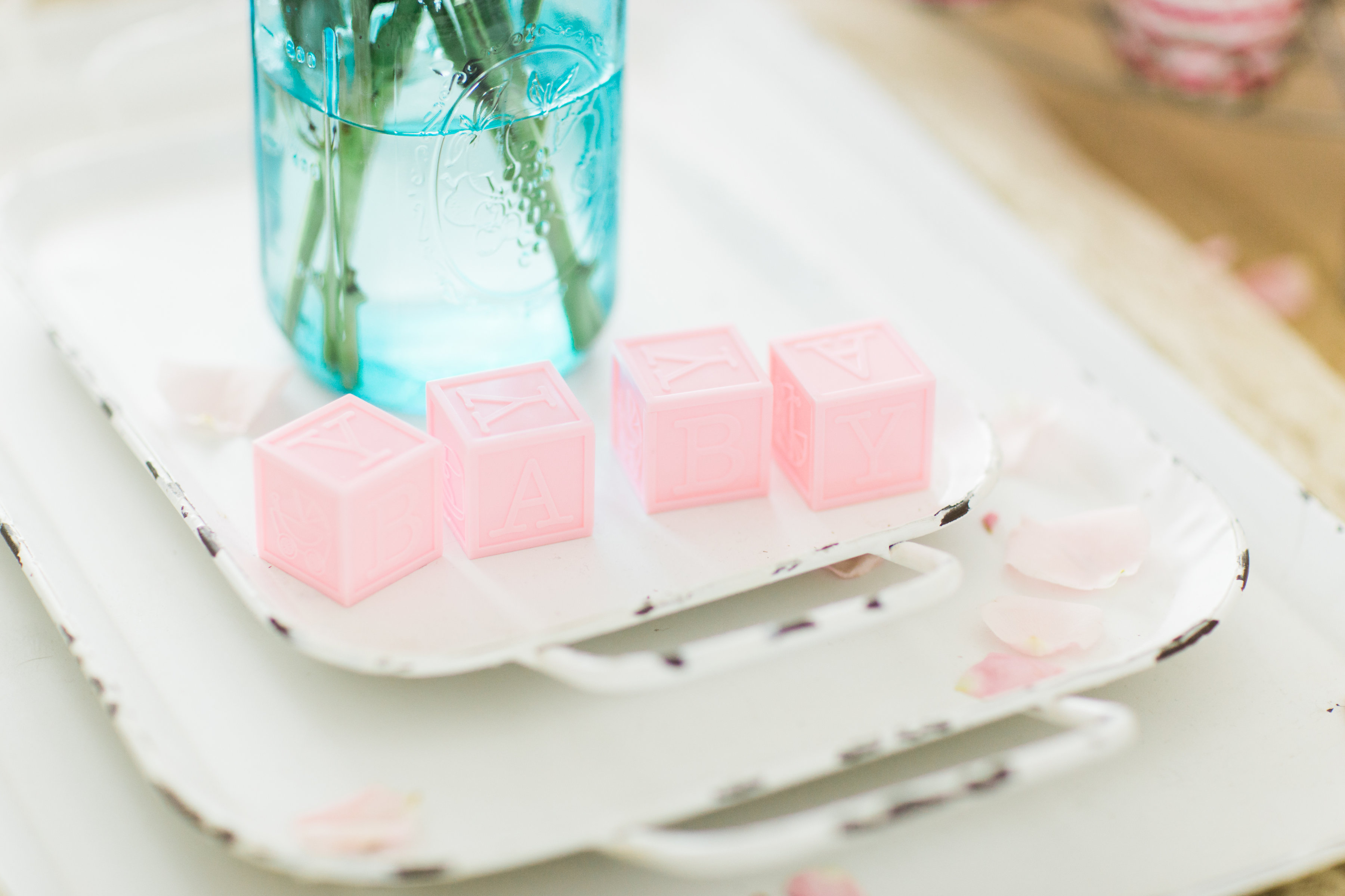 Lifestyle blogger Lexi of Glitter, Inc. shares how to throw a tea party baby shower in 6 easy steps; plus a DIY diaper cake using cupcake liners! #babyshower #teaparty #teapartybabyshower #shower #teapartyshower #party #newbaby #baby | Click through for the details. | glitterinc.com | @glitterinc