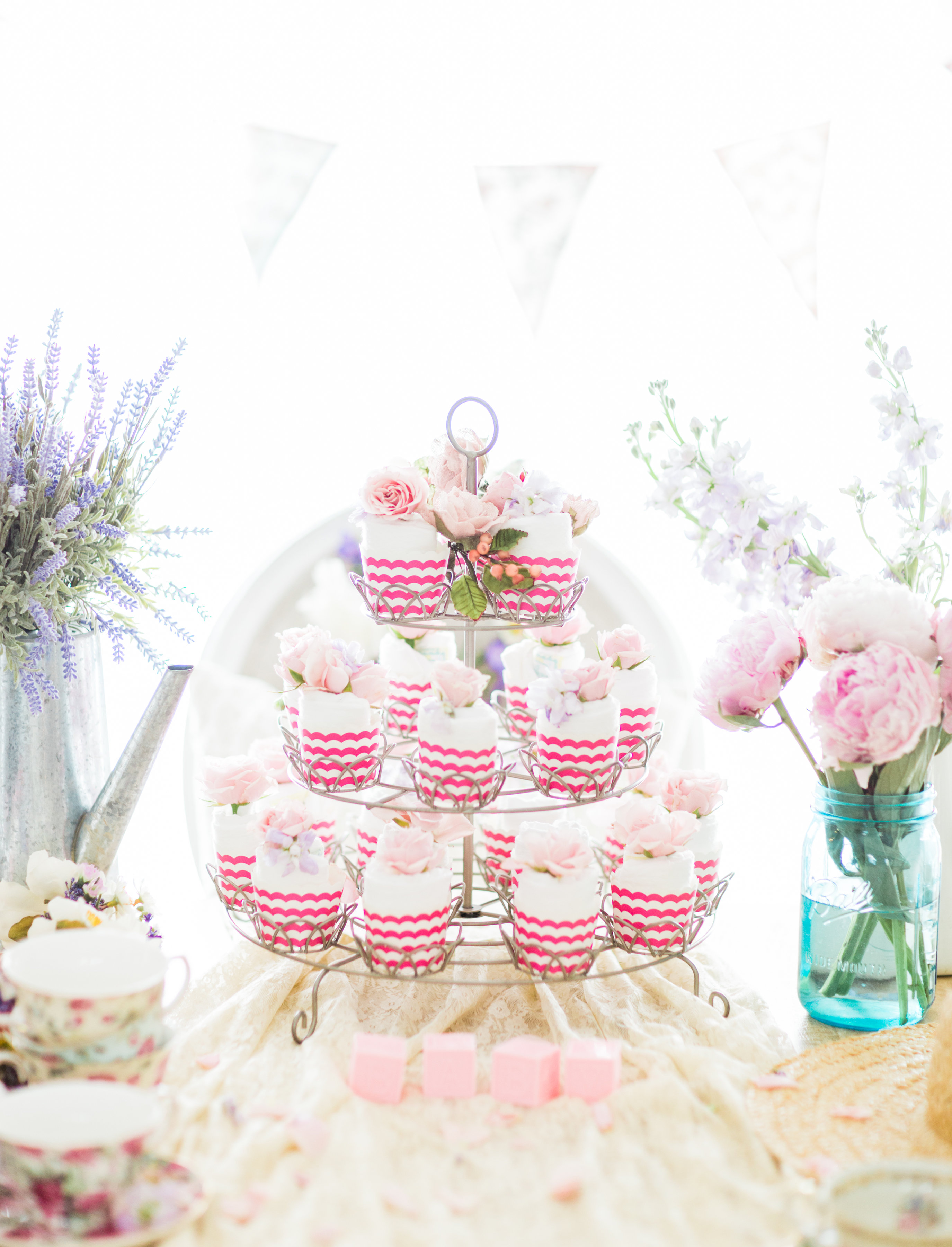 Lifestyle blogger Lexi of Glitter, Inc. shares how to throw a tea party baby shower in 6 easy steps; plus a DIY diaper cake using cupcake liners! #babyshower #teaparty #teapartybabyshower #shower #teapartyshower #party #newbaby #baby | Click through for the details. | glitterinc.com | @glitterinc