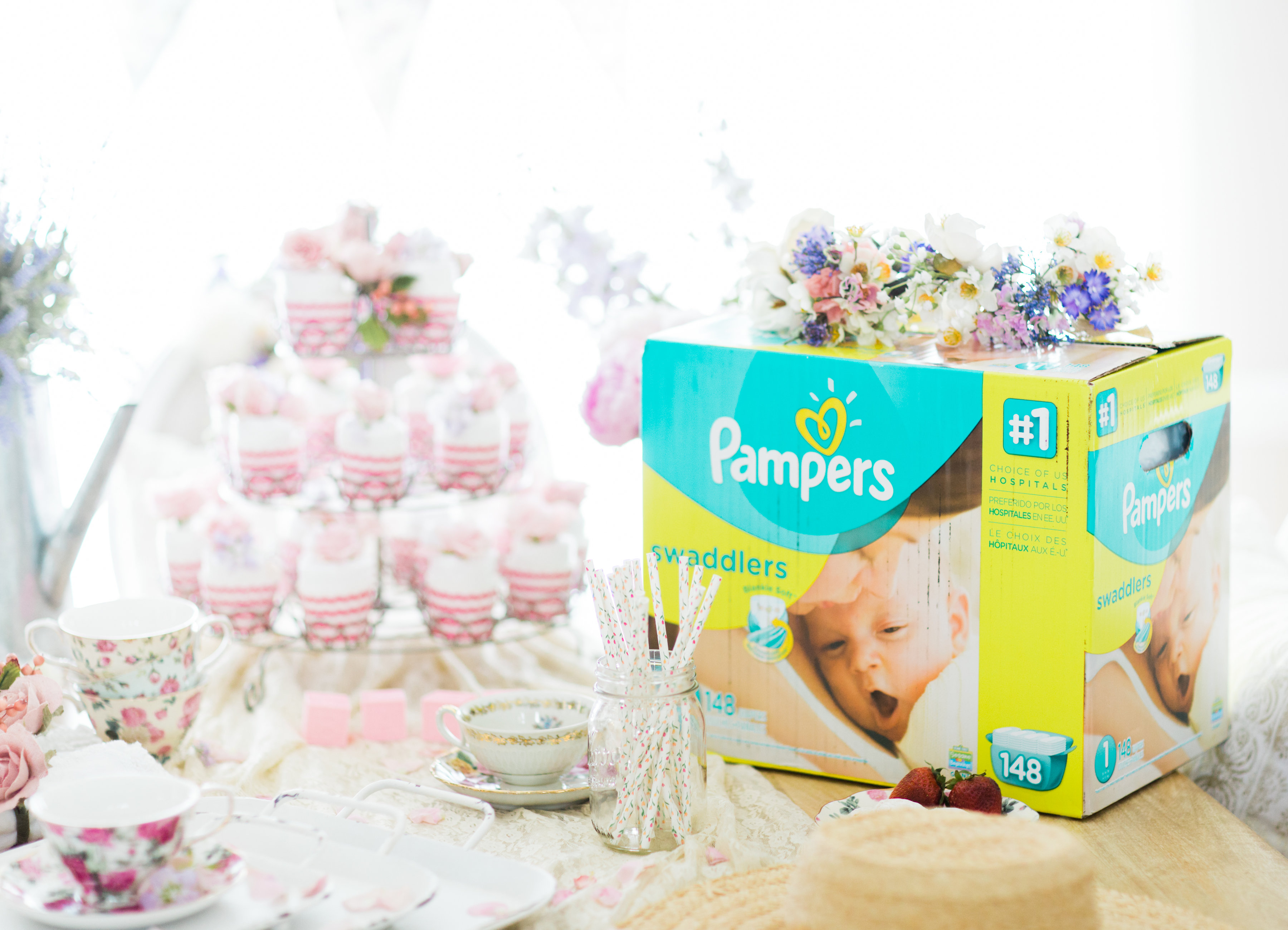 Lifestyle blogger Lexi of Glitter, Inc. shares how to throw a tea party baby shower in 6 easy steps; plus a DIY diaper cake using cupcake liners! #babyshower #teaparty #teapartybabyshower #shower #teapartyshower #party #newbaby #baby | Click through for the details. | glitterinc.com | @glitterinc