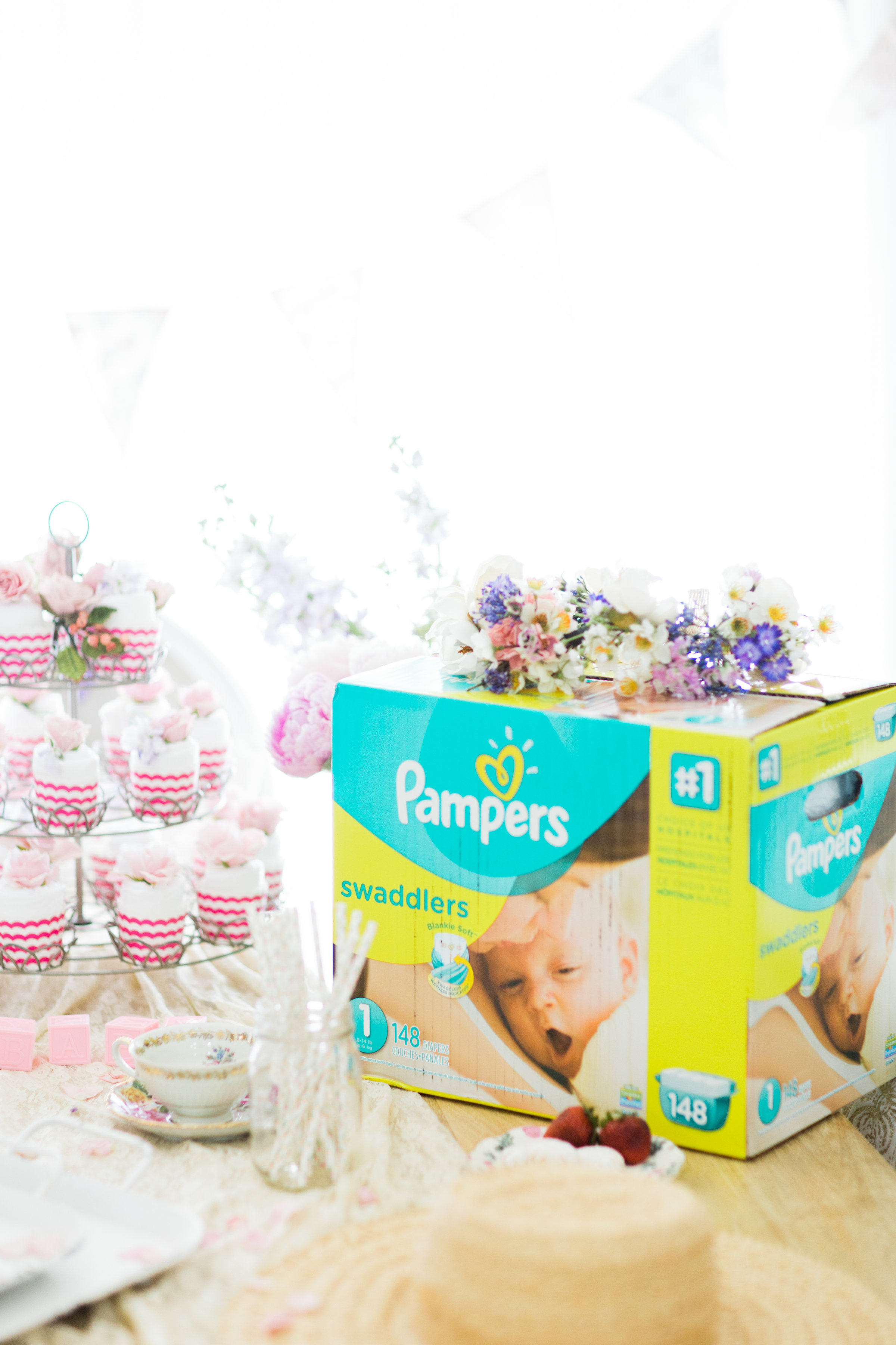 Lifestyle blogger Lexi of Glitter, Inc. shares how to throw a tea party baby shower in 6 easy steps; plus a DIY diaper 