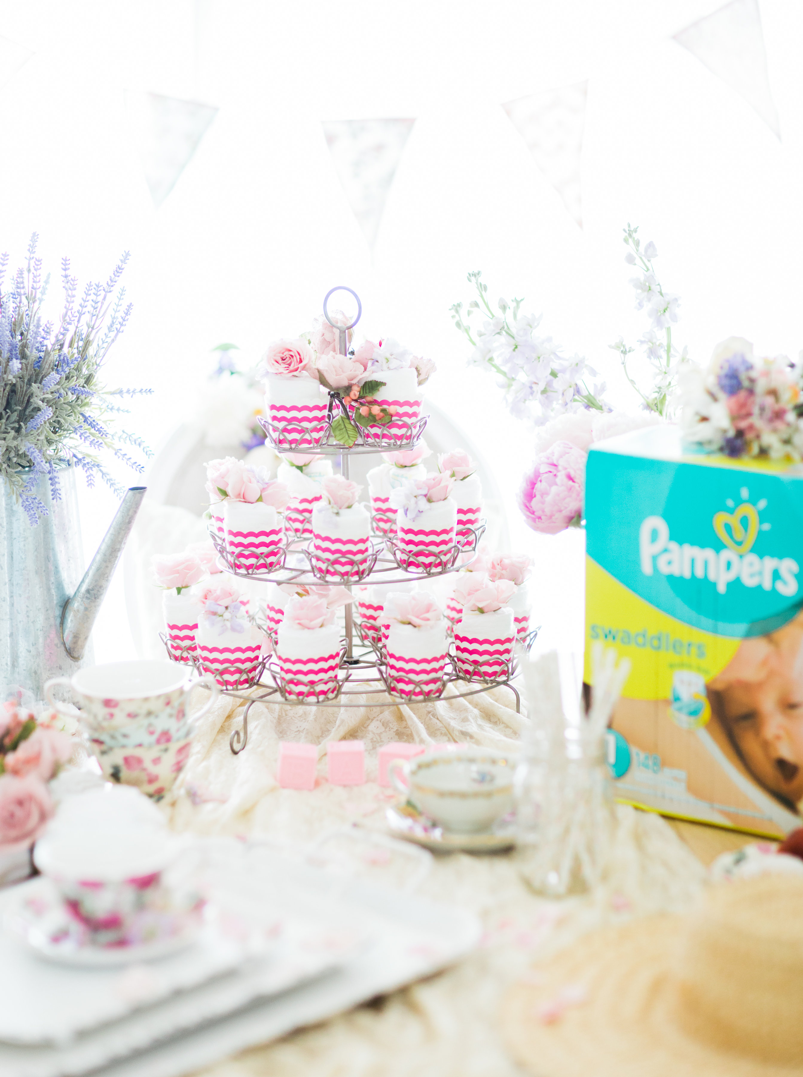 Lifestyle blogger Lexi of Glitter, Inc. shares how to throw a tea party baby shower in 6 easy steps; plus a DIY diaper cake using cupcake liners! #babyshower #teaparty #teapartybabyshower #shower #teapartyshower #party #newbaby #baby | Click through for the details. | glitterinc.com | @glitterinc