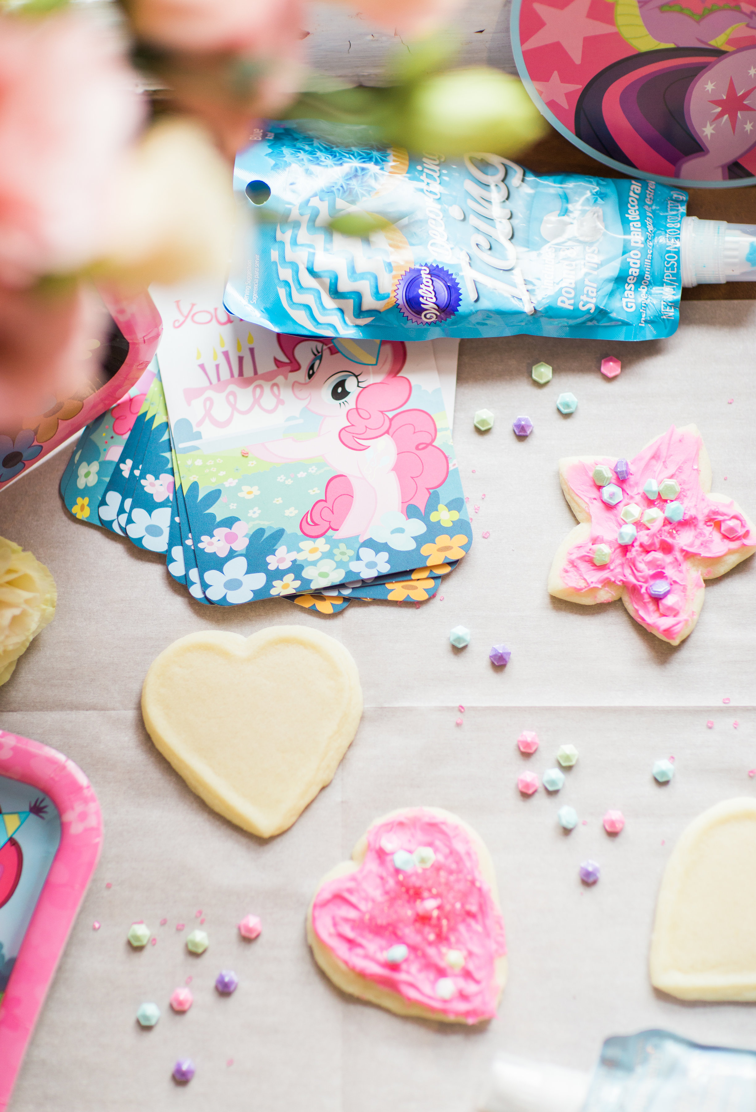 Lifestyle blogger Lexi of Glitter, Inc. shares how to throw your own My Little Pony Party: complete with a cookie decorating station. | glitterinc.com | @glitterinc