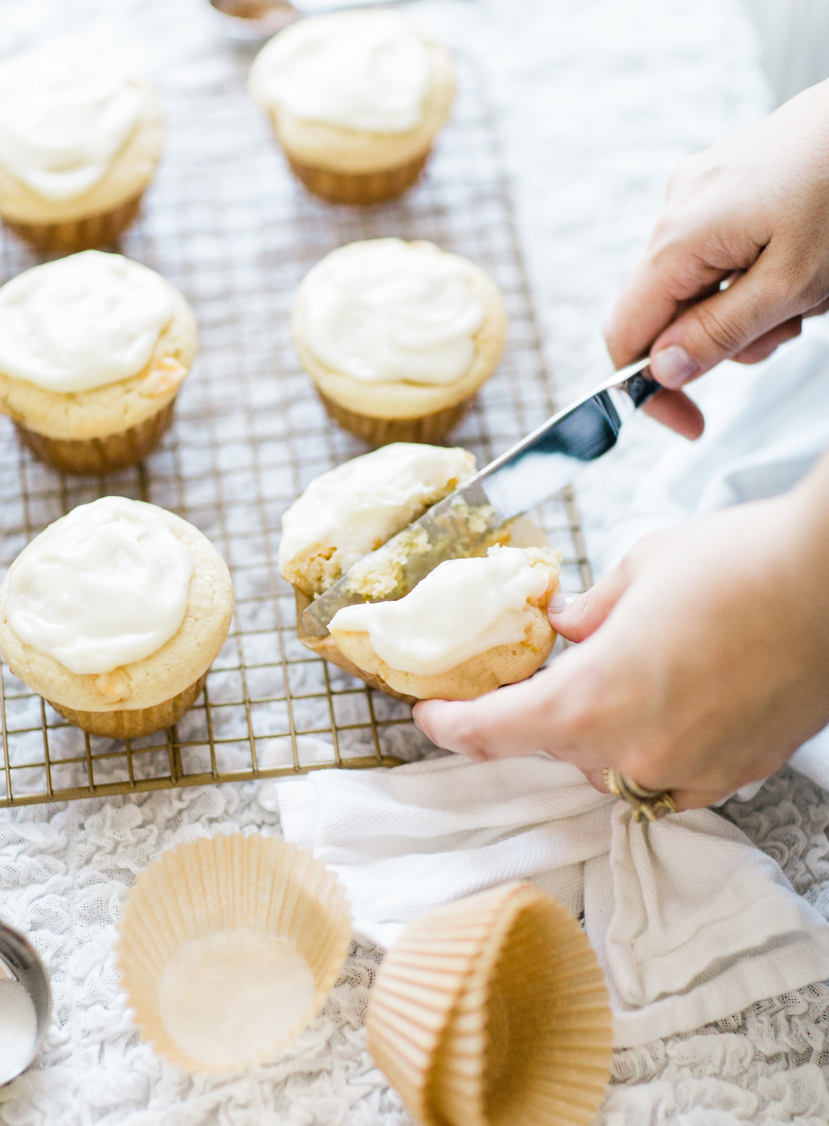 Lifestyle blogger Lexi of Glitter, Inc. shares her recipe for heavenly peaches and cream muffins with decadent cream cheese frosting. | glitterinc.com | @glitterinc