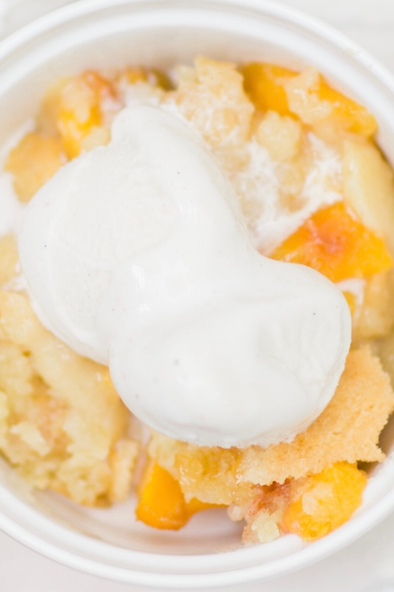 This classic peach cobbler is everything an amazing homemade fruit cobbler should be: gooey fresh fruit filling, topped with a layer of moist, buttery, doughy cobbler. If you are on the hunt for the perfect peach cobbler this is it! Click through for the recipe. | glitterinc.com | @glitterinc