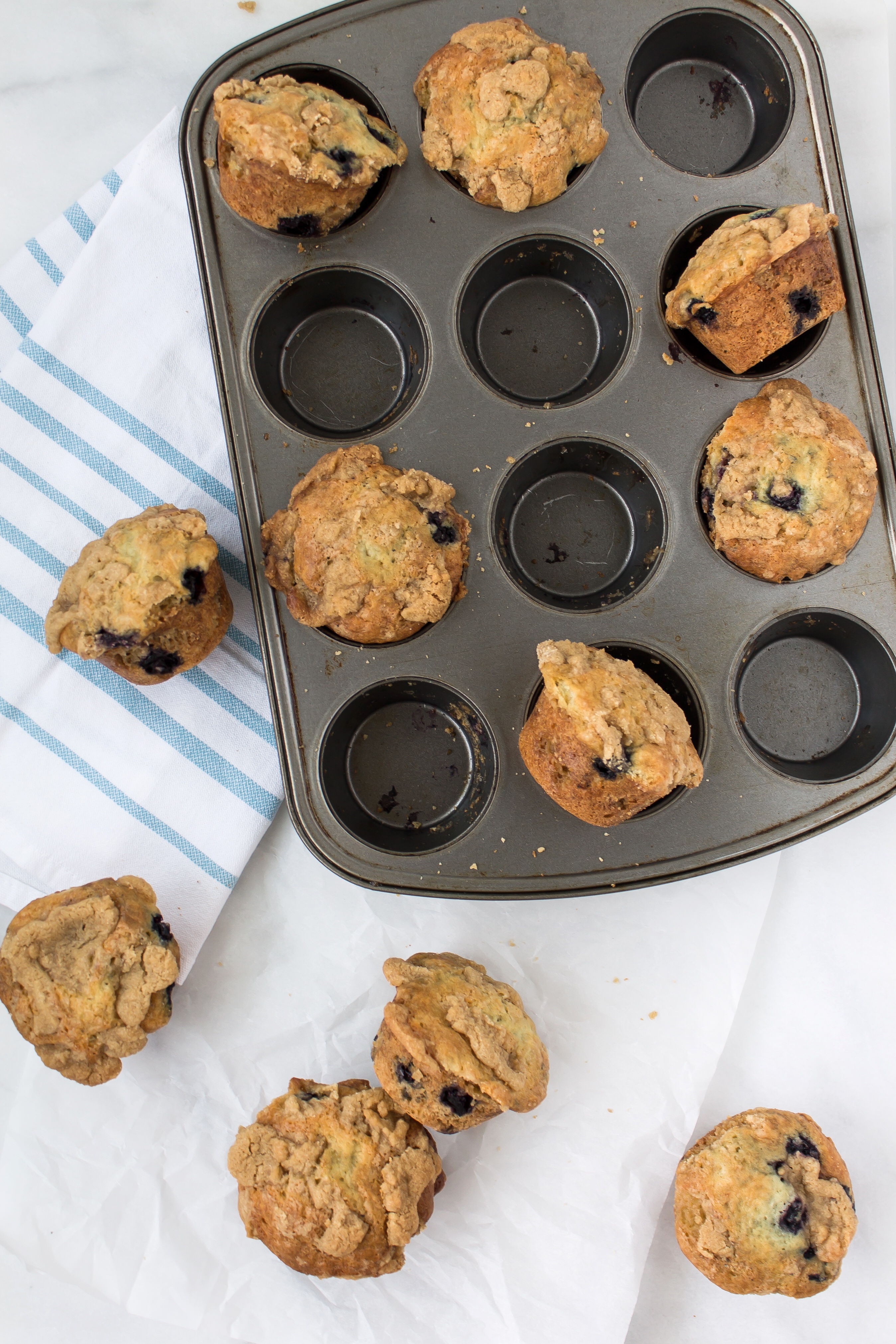 The most incredible blueberry lavender streusel muffins packed with fresh blueberries, a hint of delicate lavender, and topped with a buttery-sweet streusel. YUM. Click through for the recipe. | glitterinc.com | @glitterinc