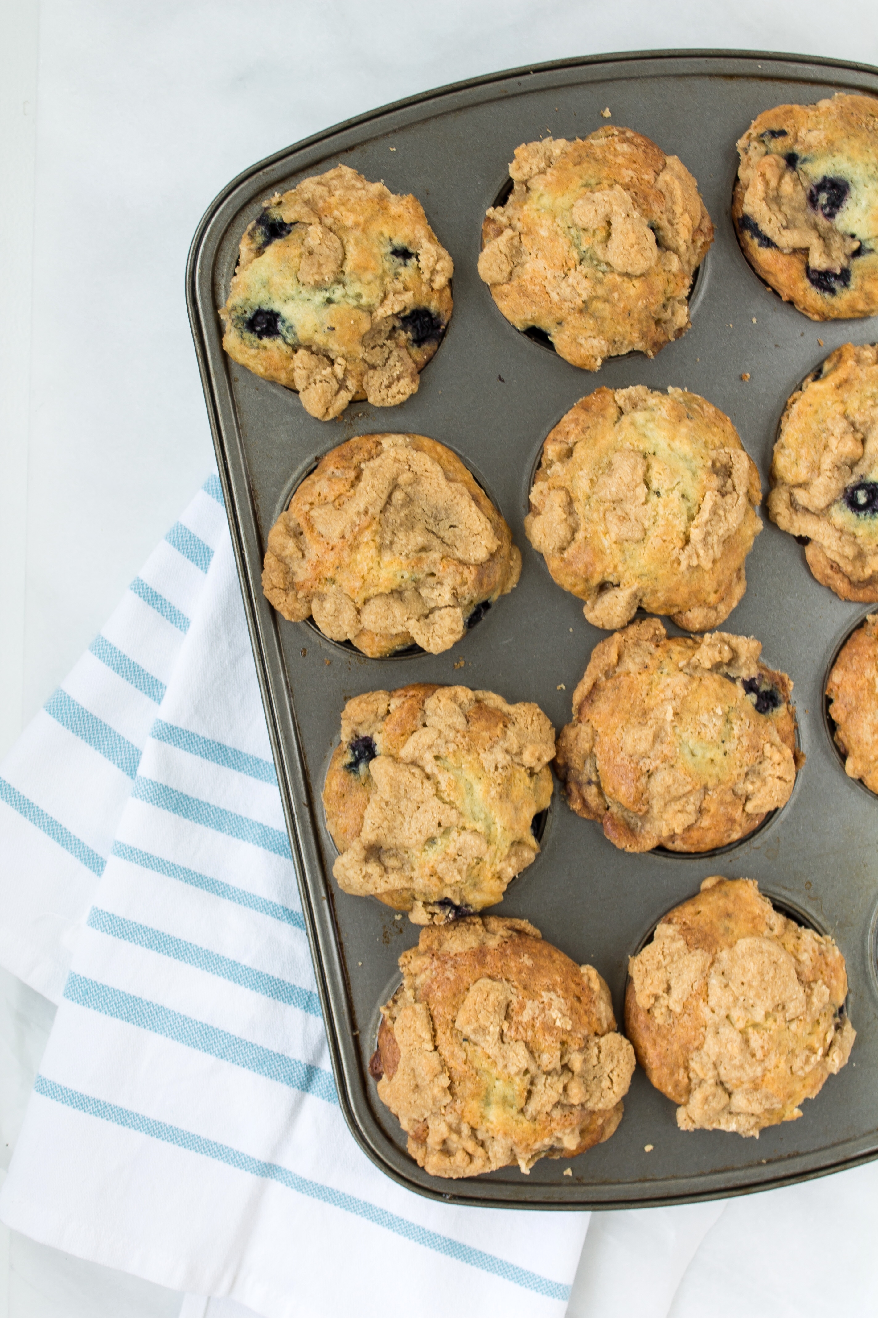 The most incredible blueberry lavender streusel muffins packed with fresh blueberries, a hint of delicate lavender, and topped with a buttery-sweet streusel. YUM. Click through for the recipe. | glitterinc.com | @glitterinc