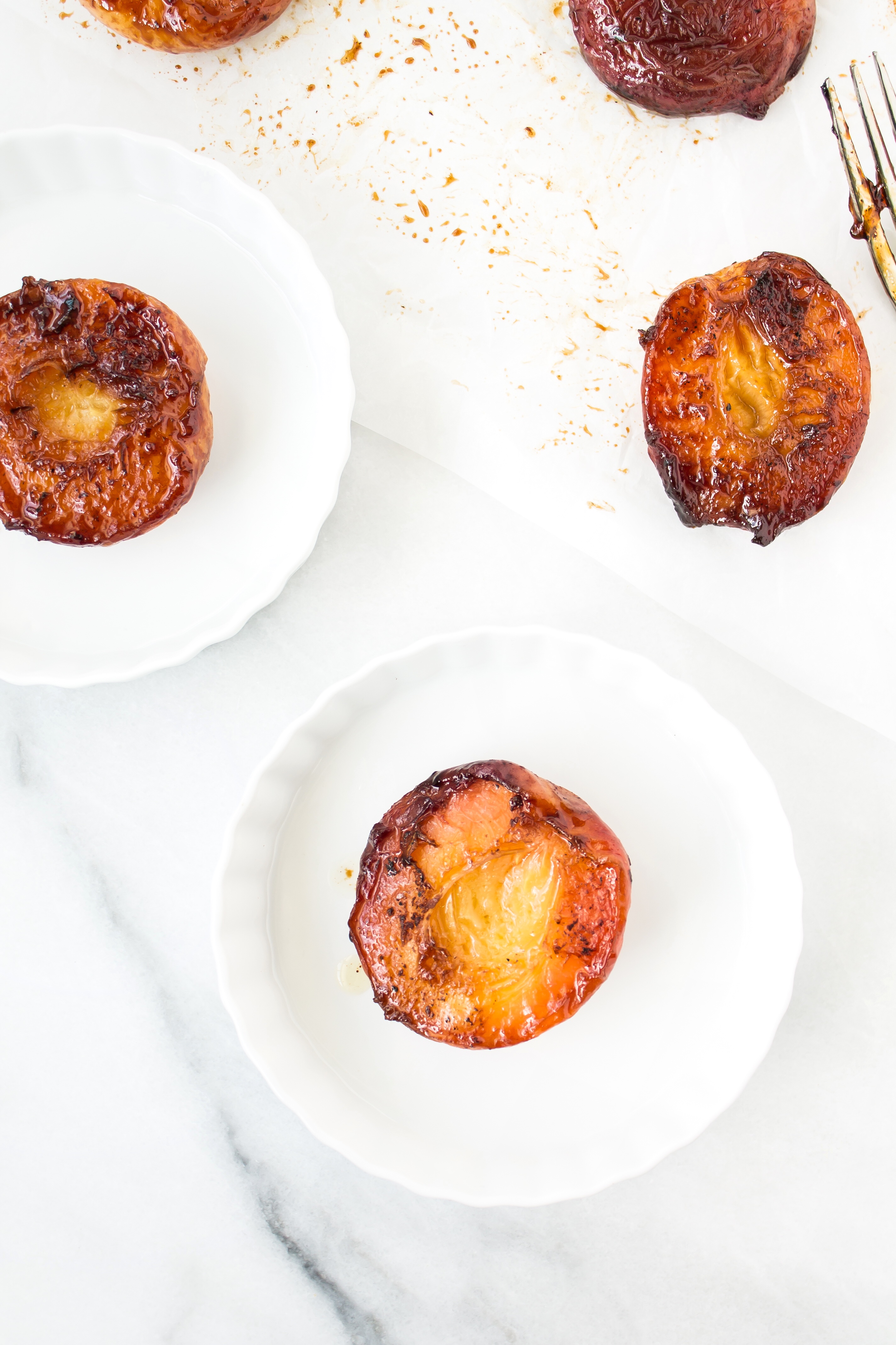 Foodie blogger Lexi of Glitter, Inc. shares the most incredible caramely roasted peaches with yogurt and homemade streusel. Click through for the recipe. | glitterinc.com | @glitterinc