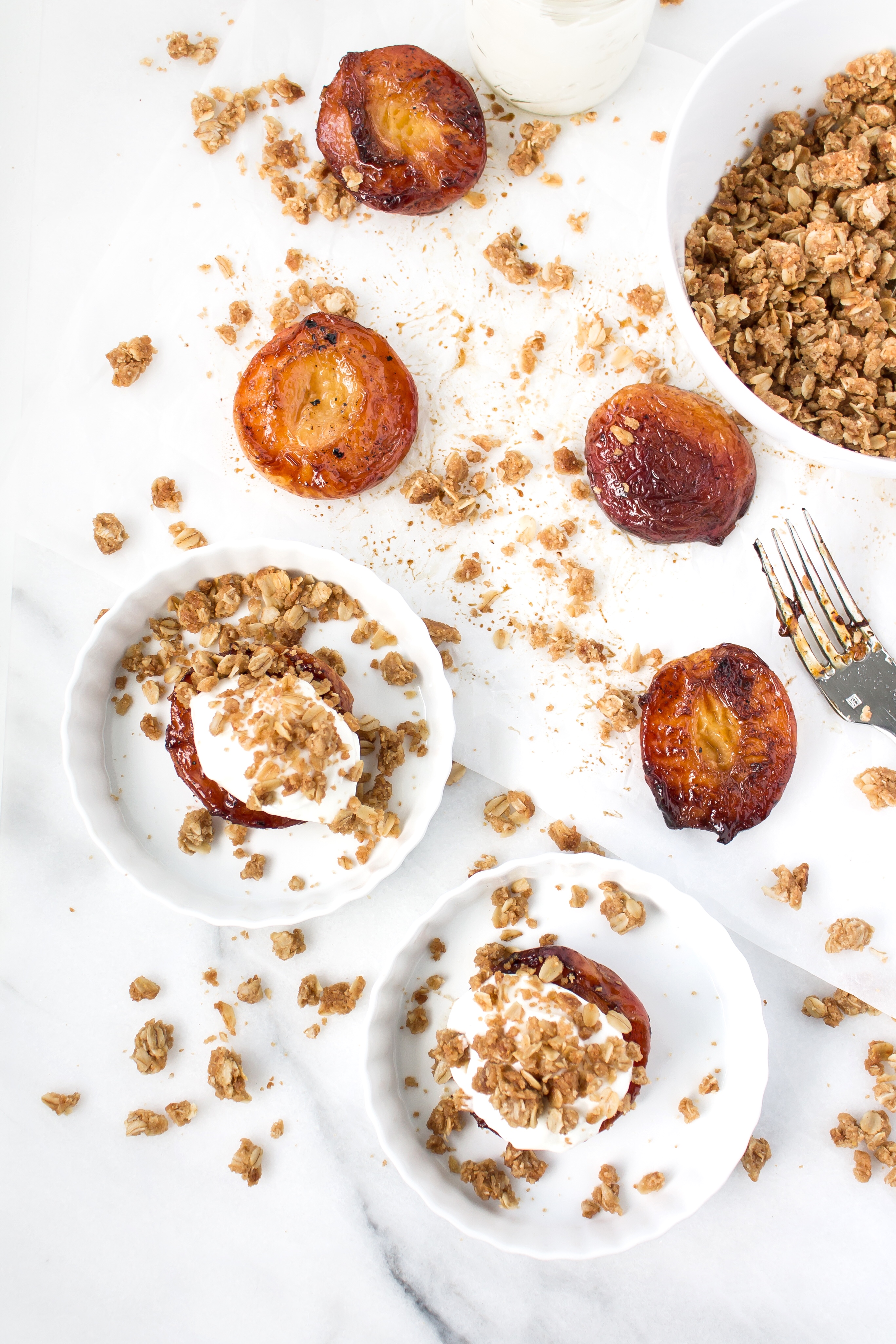 Foodie blogger Lexi of Glitter, Inc. shares the most incredible caramely roasted peaches with yogurt and homemade streusel. Click through for the recipe. | glitterinc.com | @glitterinc