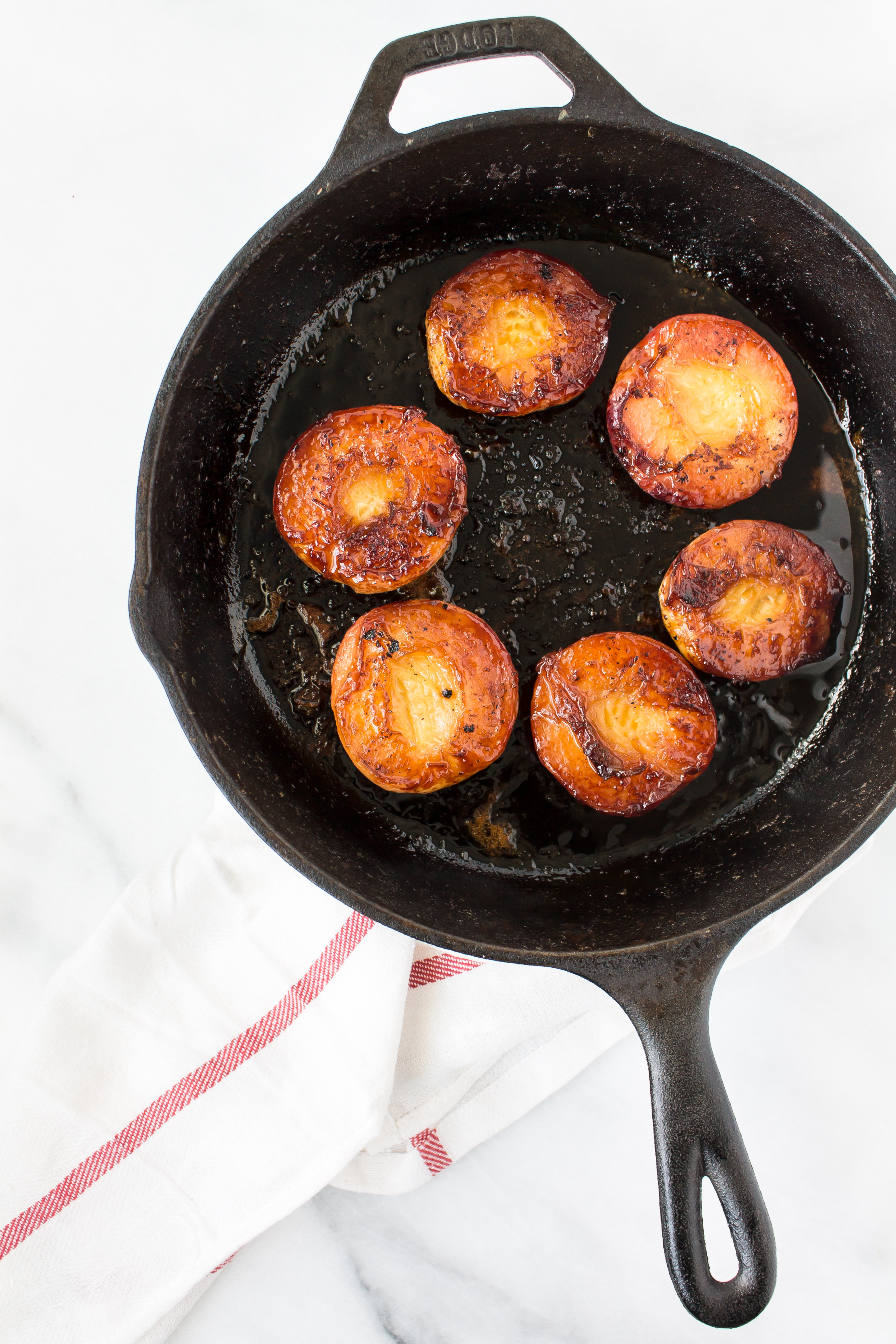 Foodie blogger Lexi of Glitter, Inc. shares the most incredible caramely roasted peaches with yogurt and homemade streusel. Click through for the recipe. | glitterinc.com | @glitterinc