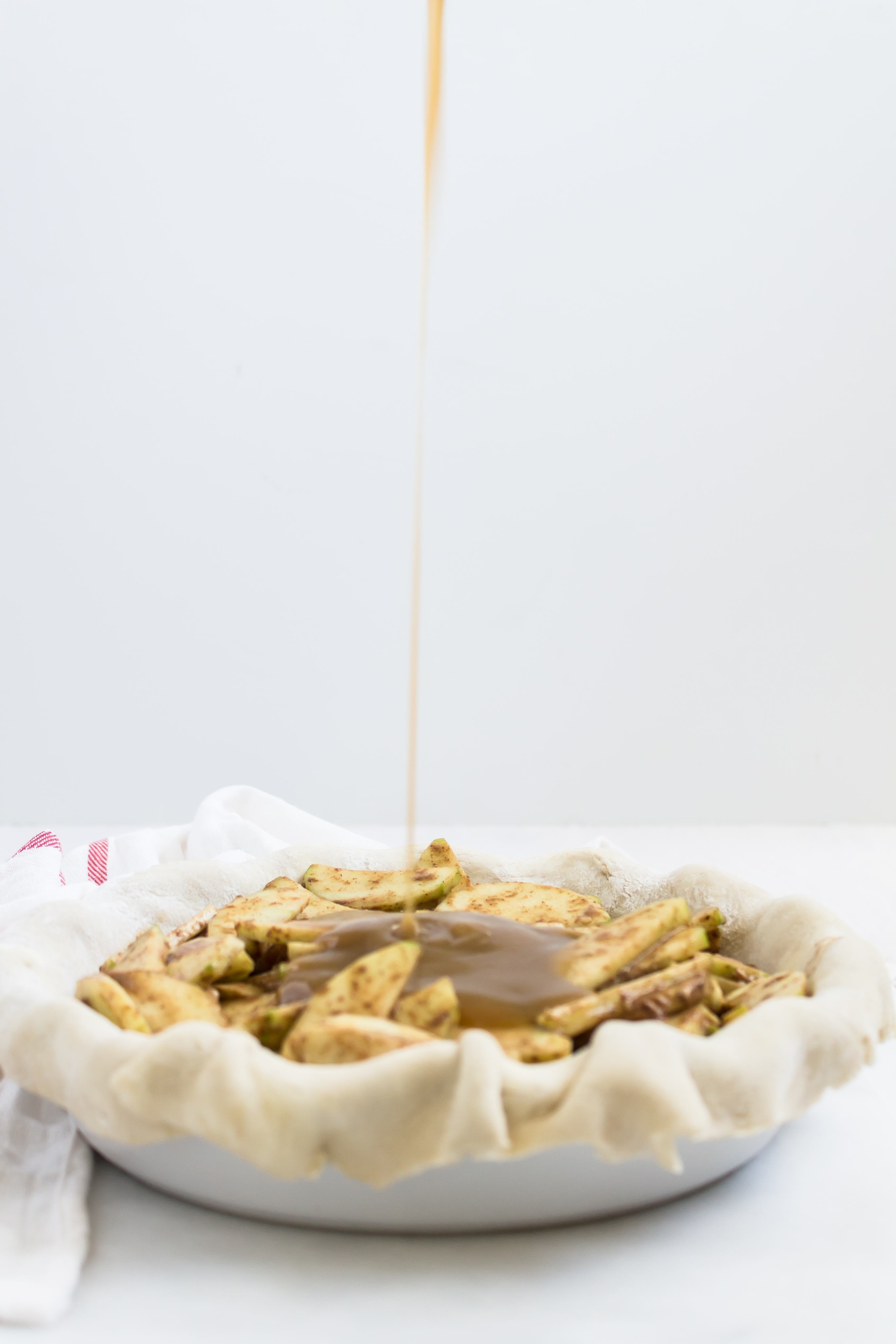 Prepare to FREAK out over this spin on a more traditional apple pie drizzled with warm homemade salted maple caramel sauce. Click through for the recipe. | glitterinc.com | @glitterinc