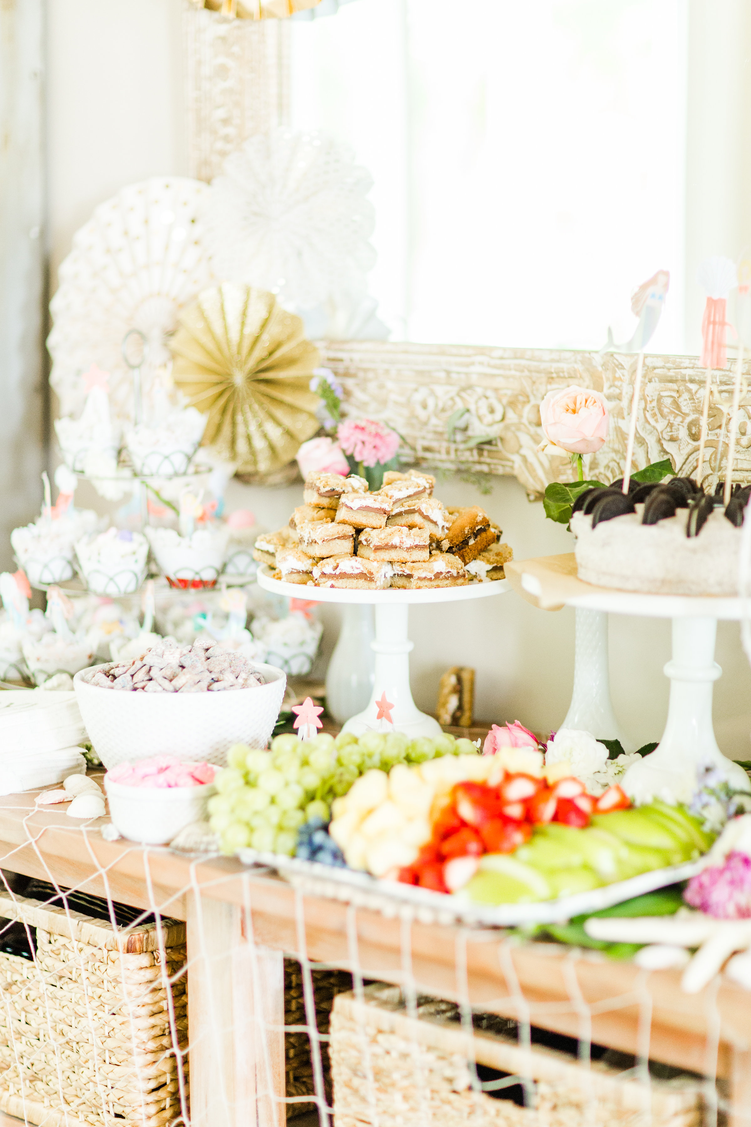 Behind-the-scenes of a magical, whimsical little girl's mermaid birthday party, complete with mermaid dessert bar, games, prizes, and crafts. Click through for the details. | glitterinc.com | @glitterinc