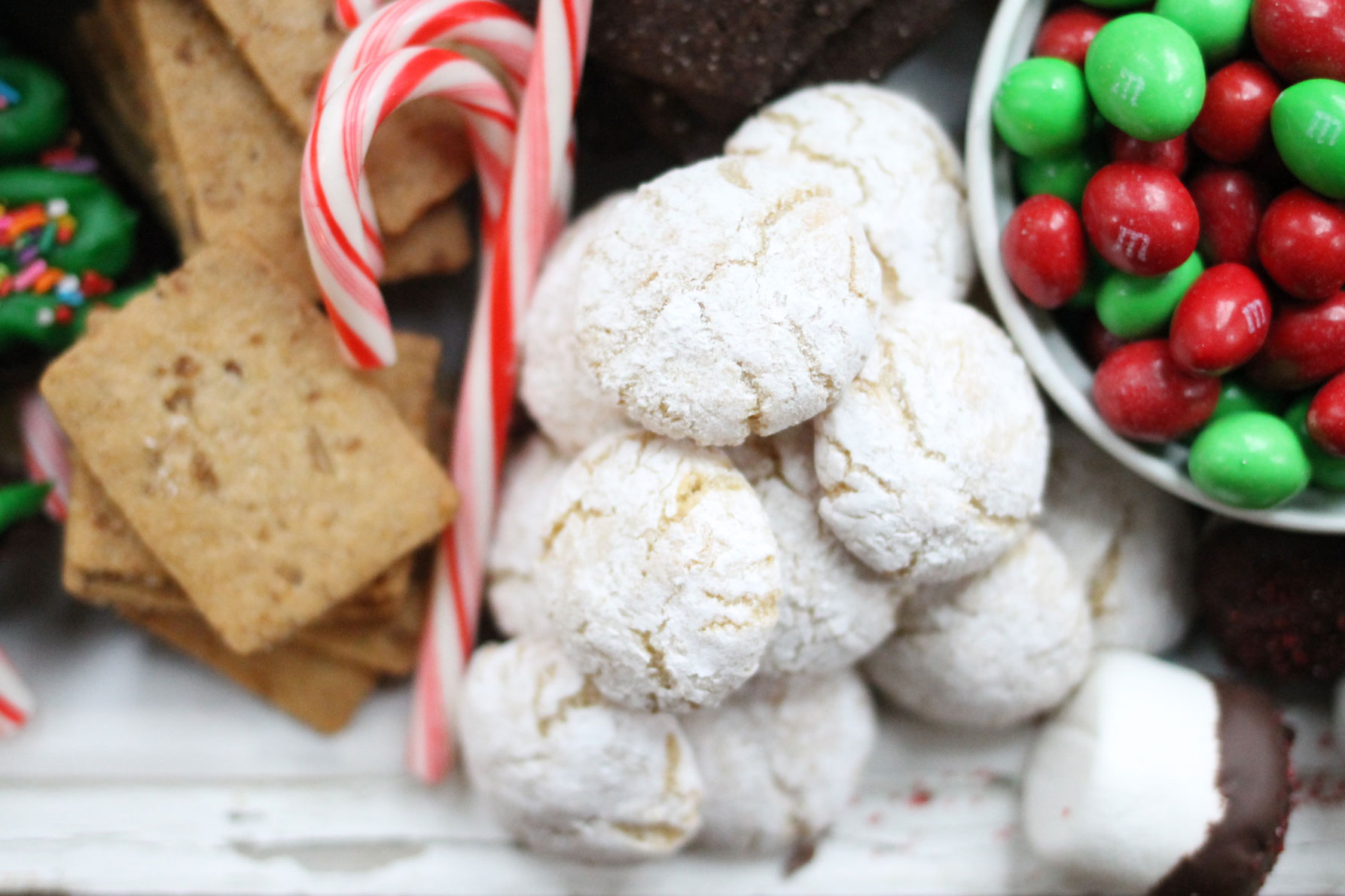 How to make the ultimate dessert snack board for the holidays; a.k.a., a sweet charcuterie spread. | glitterinc.com | @glitterinc - How to Make a Holiday Dessert Charcuterie Board by North Carolina foodie blogger Glitter, Inc.