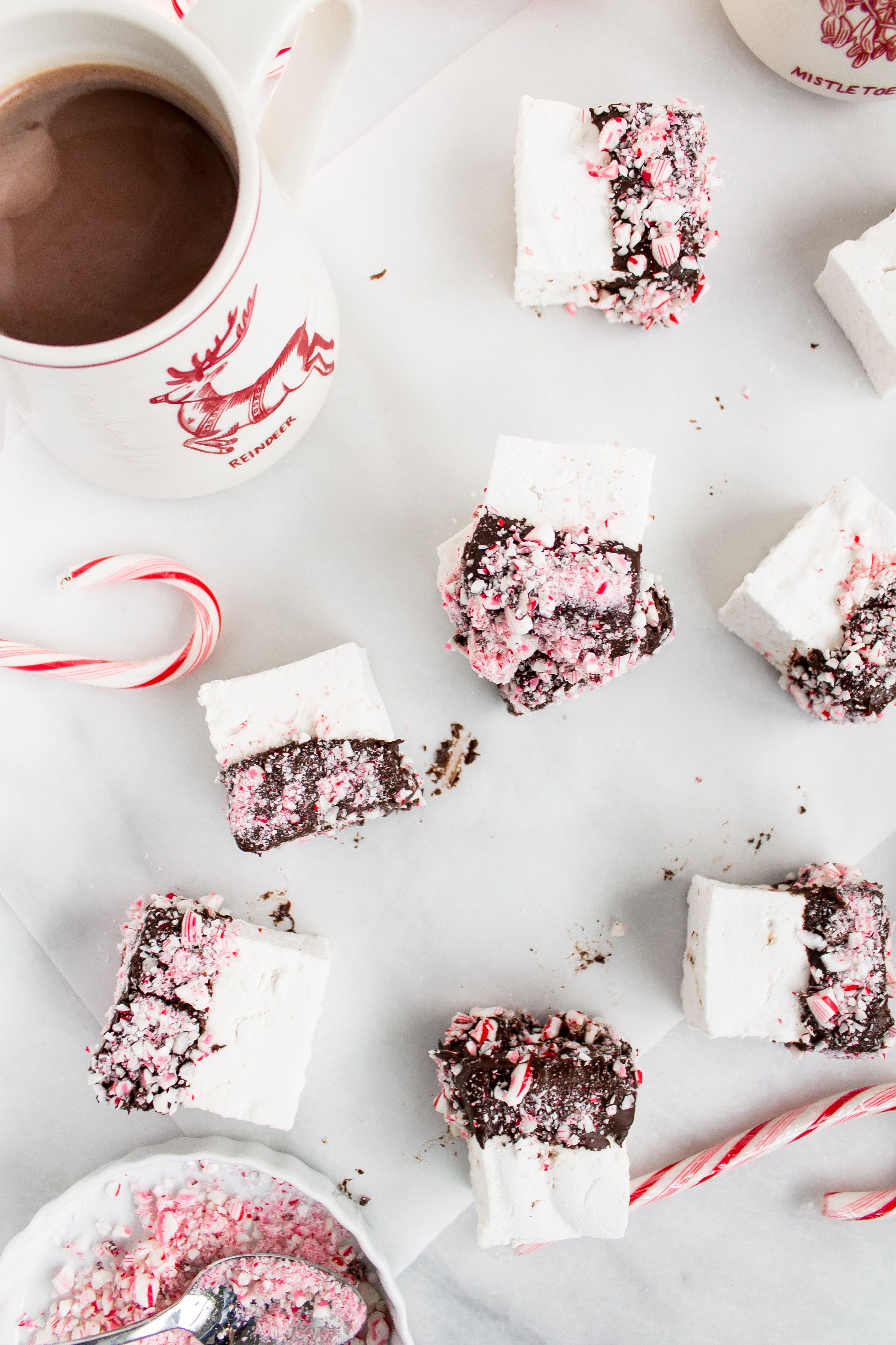 There's nothing like homemade marshmallows. Dipping those fluffy marshmallows in chocolate and crushed peppermint for the holidays is just the icing on the cake ... errr, marshmallow. Click through for the recipe. | glitterinc.com | @glitterinc