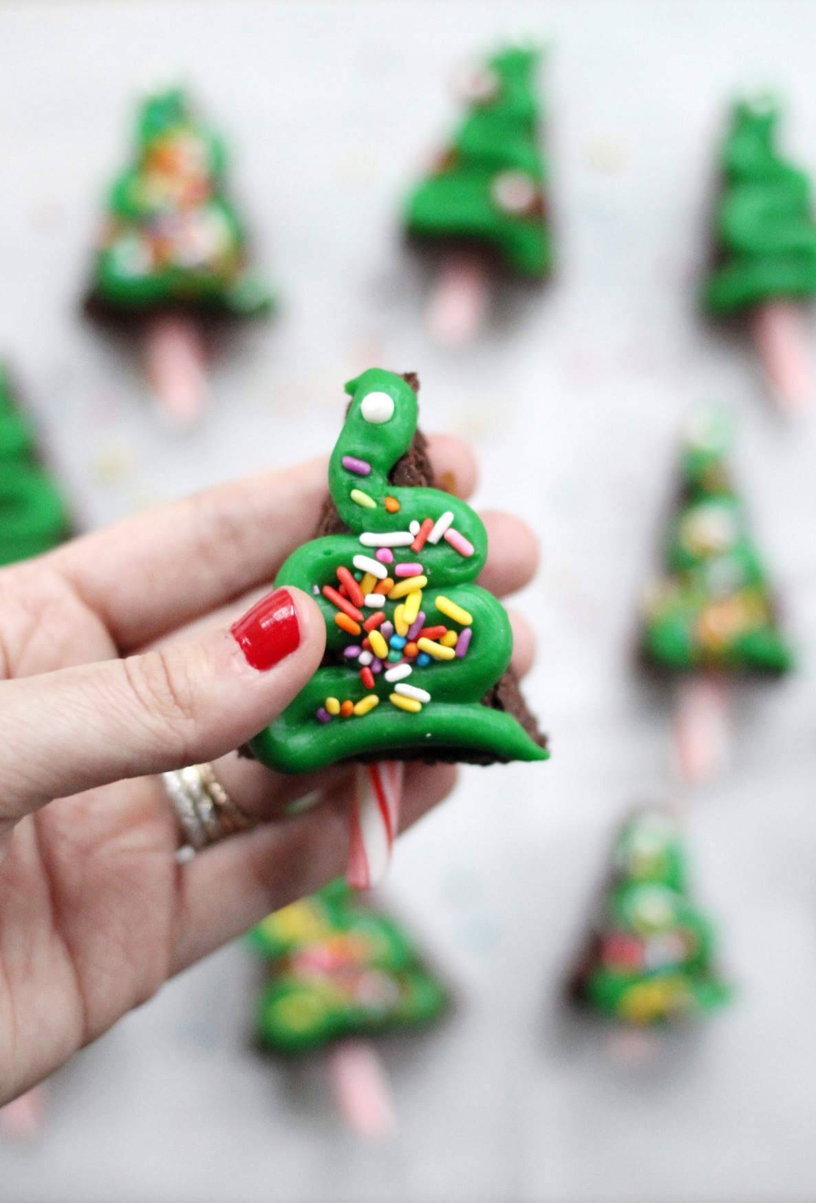 You're going to want to make these really stinkin' cute Christmas tree shaped brownies for ALL of your holiday parties! Click through for the DIY. | glitterinc.com | @glitterinc - How to Make The Cutest Easy Christmas Brownies by North Carolina foodie blogger Glitter, Inc.