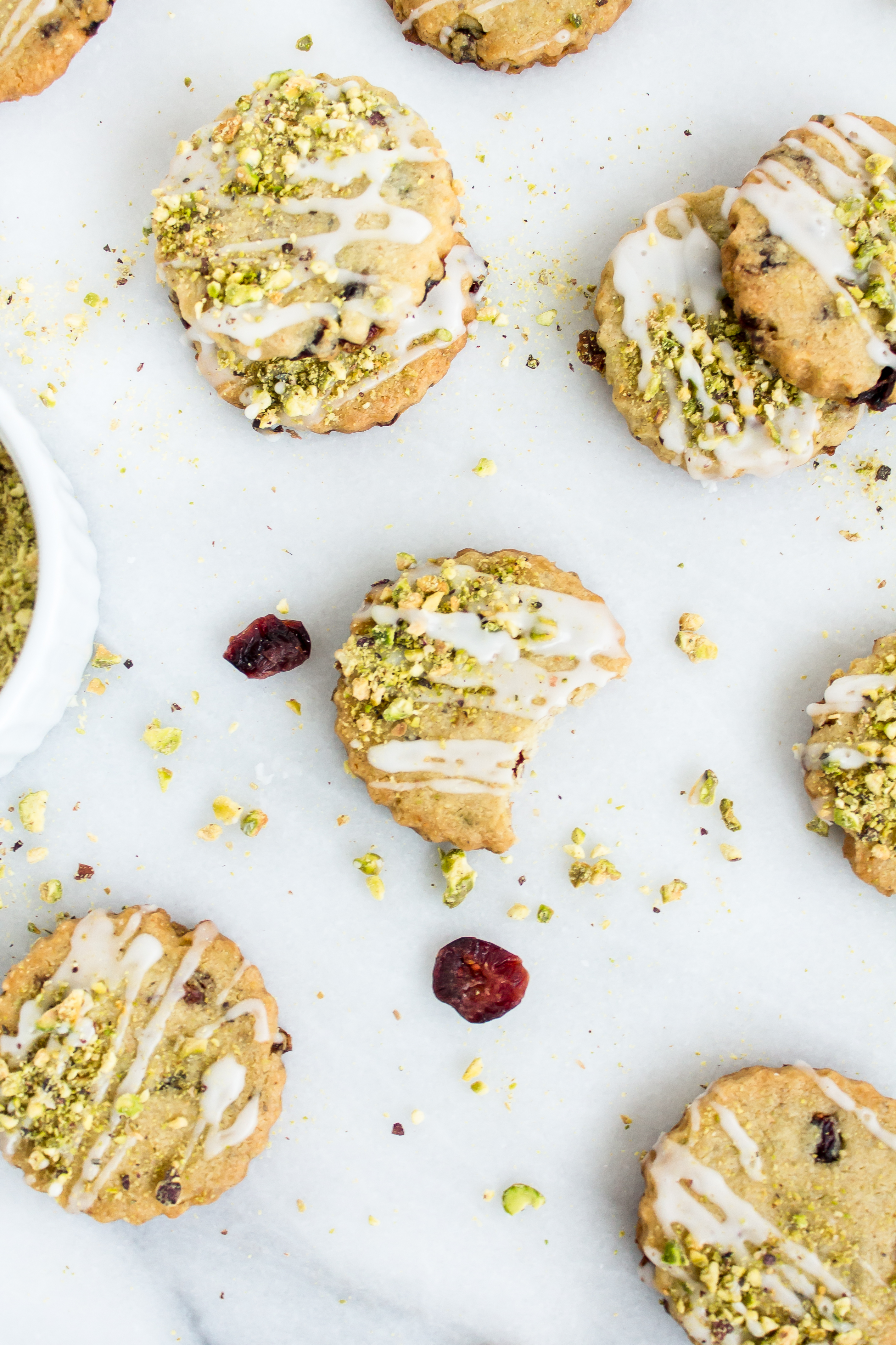 Looking for an incredible new favorite shortbread recipe? Look no further than these frosted pistachio cranberry shortbread cookies! | glitterinc.com | @glitterinc - Frosted Pistachio Cranberry Shortbread Cookies Recipe by North Carolina foodie blogger Glitter, Inc.