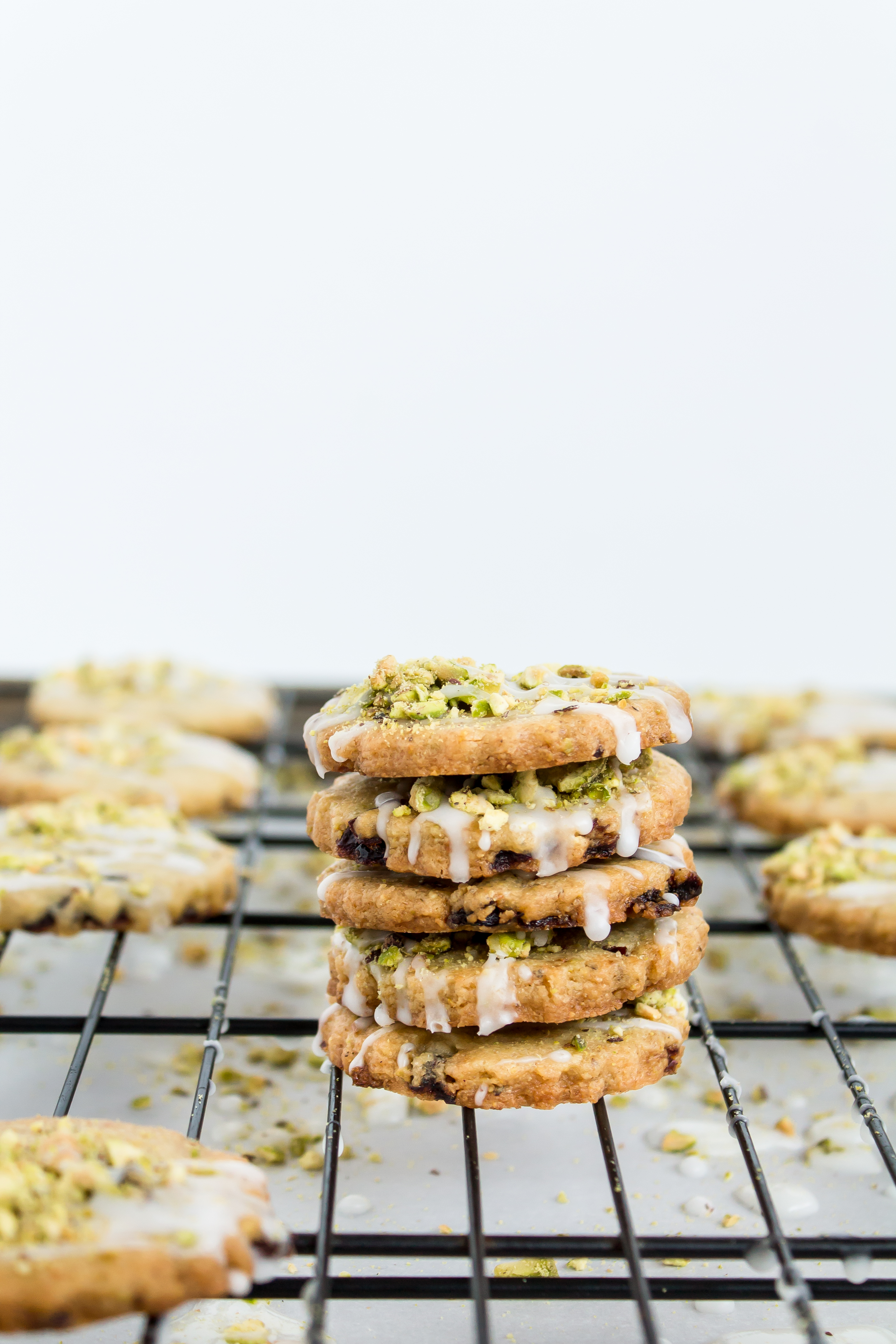 Looking for an incredible new favorite shortbread recipe? Look no further than these frosted pistachio cranberry shortbread cookies! | glitterinc.com | @glitterinc - Frosted Pistachio Cranberry Shortbread Cookies Recipe by North Carolina foodie blogger Glitter, Inc.