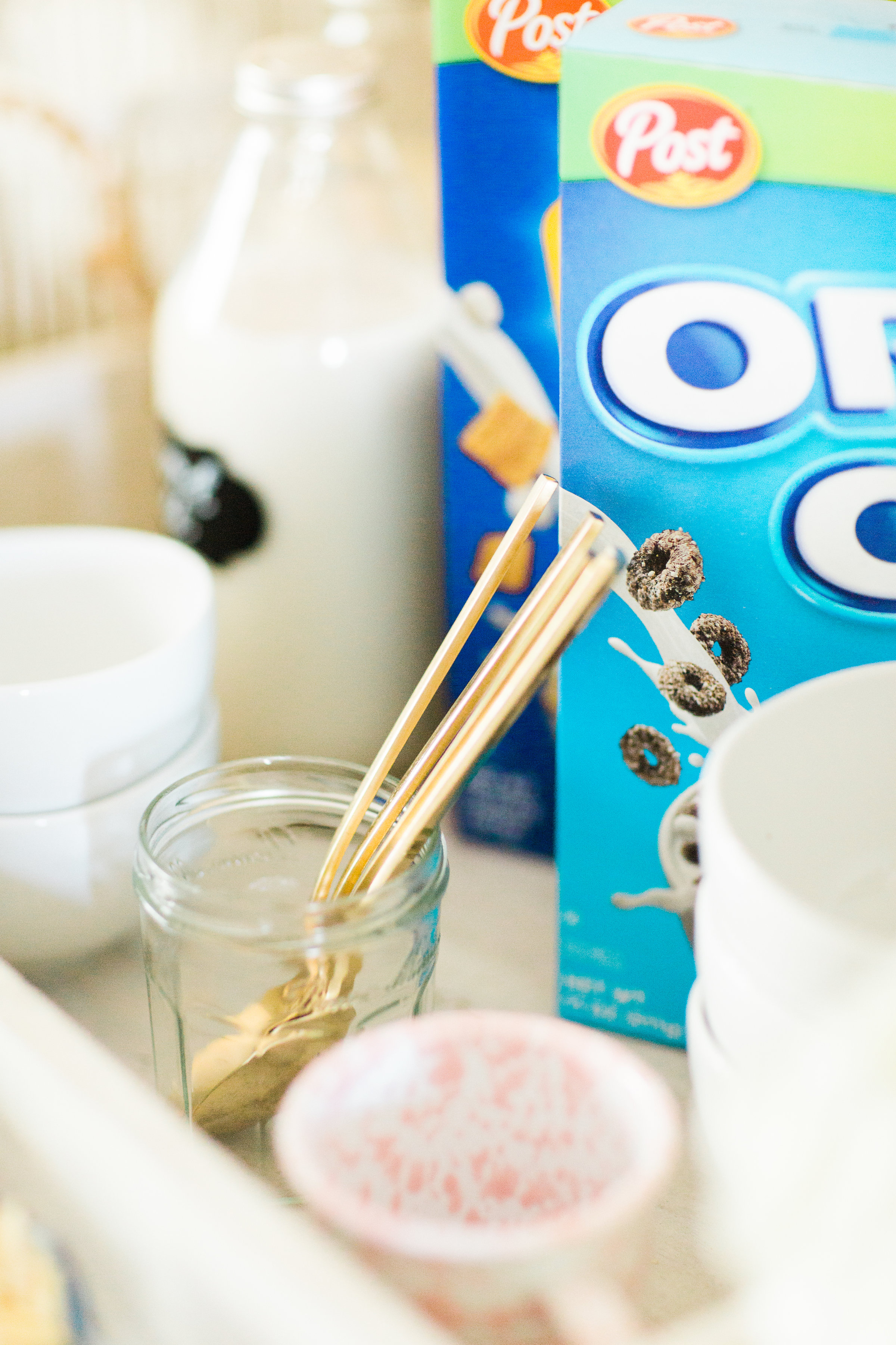 Looking for a unique and easy party dessert station? We're showing you how to put together a DIY retro cereal bar; perfect for a festive and memorable brunch, throwback party, pajama-themed soirée, or sleepover for your kids and their friends! Click through for the details. #brunch #brunchideas #cerealbar #cerealstation #party #partyideas #sleepoverparty #pajamaparty | glitterinc.com | @glitterinc