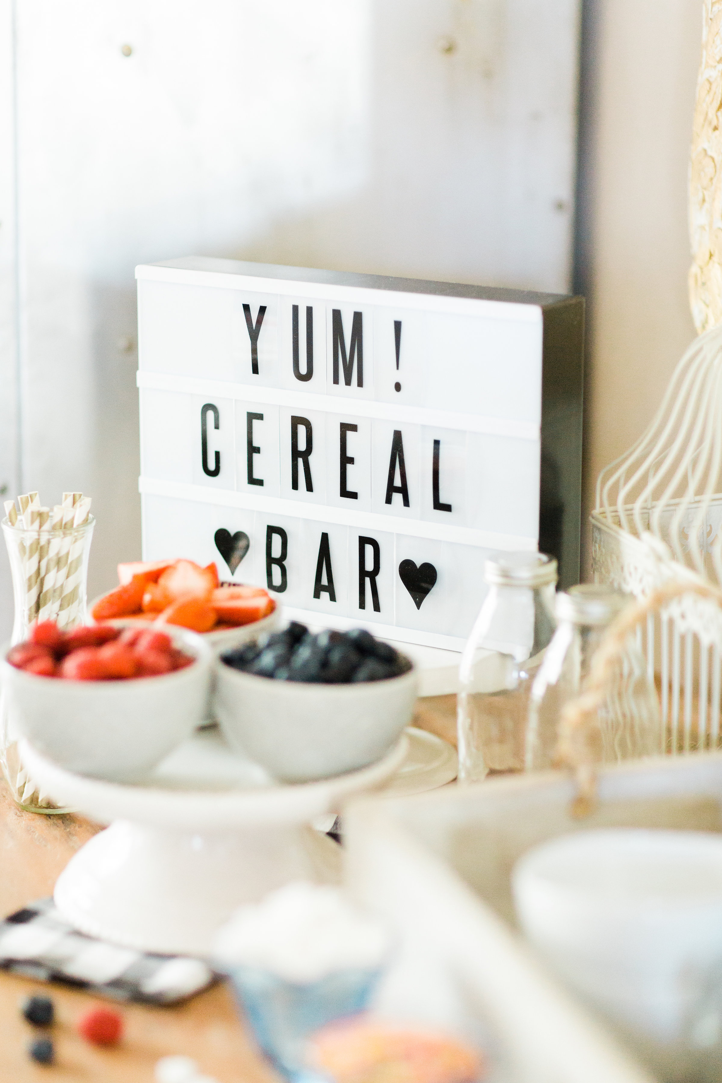 Looking for a unique and easy party dessert station? We're showing you how to put together a DIY retro cereal bar; perfect for a festive and memorable brunch, throwback party, pajama-themed soirée, or sleepover for your kids and their friends! Click through for the details. #brunch #brunchideas #cerealbar #cerealstation #party #partyideas #sleepoverparty #pajamaparty | glitterinc.com | @glitterinc