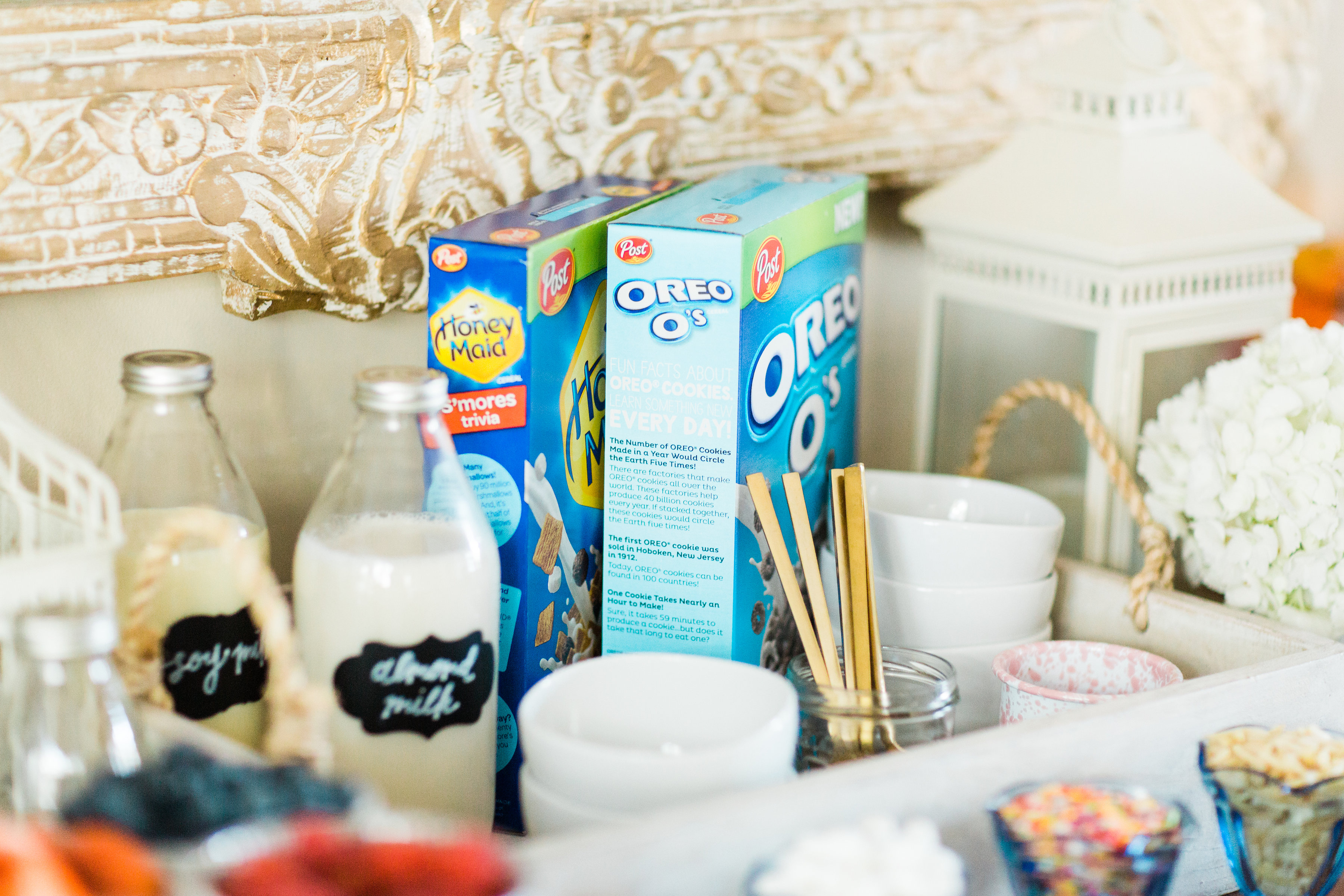 Looking for a unique and easy party dessert station? We're showing you how to put together a DIY retro cereal bar; perfect for a festive and memorable brunch, throwback party, pajama-themed soirée, or sleepover for your kids and their friends! Click through for the details. #brunch #brunchideas #cerealbar #cerealstation #party #partyideas #sleepoverparty #pajamaparty | glitterinc.com | @glitterinc